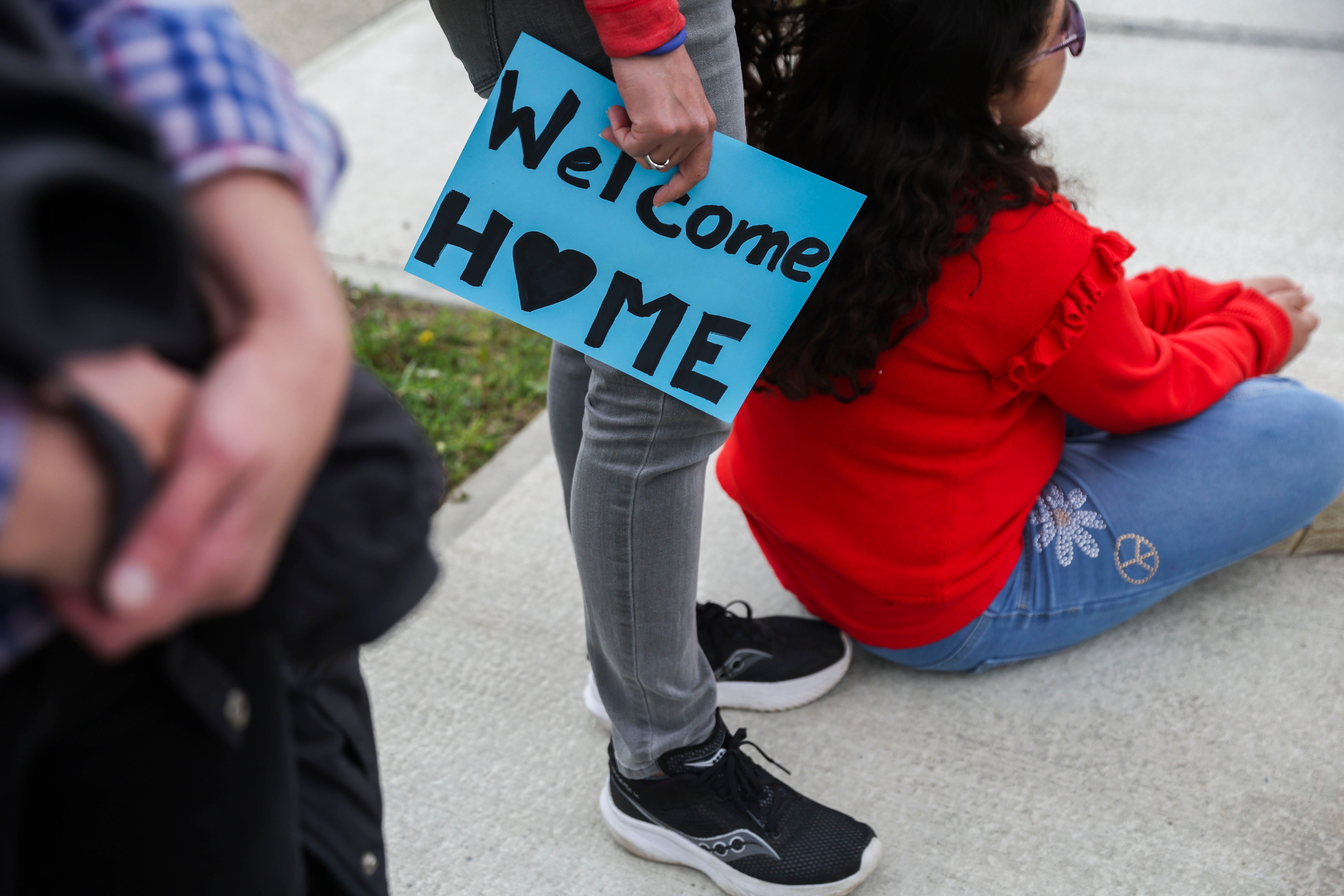 People line the street while they wait for the procession carrying the remains of World War II U.S. Army Air Forces Staff Sgt. Eugene Darrigan to pass through, Saturday, May 24, 2025, in Wappingers Falls, N.Y. Darrigan was buried in his hometown after his remains were recovered from a World War II bomber that crashed into the water off the coast of Papua New Guinea on March 11, 1944. (AP Photo/Heather Khalifa)