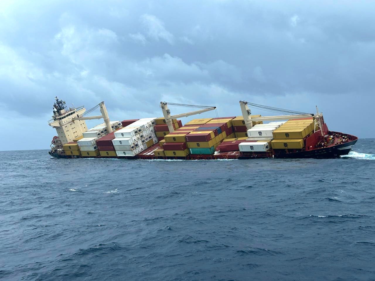 In this photo released by Indian Coast Guard, the Liberia-flagged MSC ELSA 3, a container ship carrying hazardous cargo sinks off Indian southern coast in the Arabian Sea Sunday, May 25, 2025. (Indian Coast Guard vis AP)