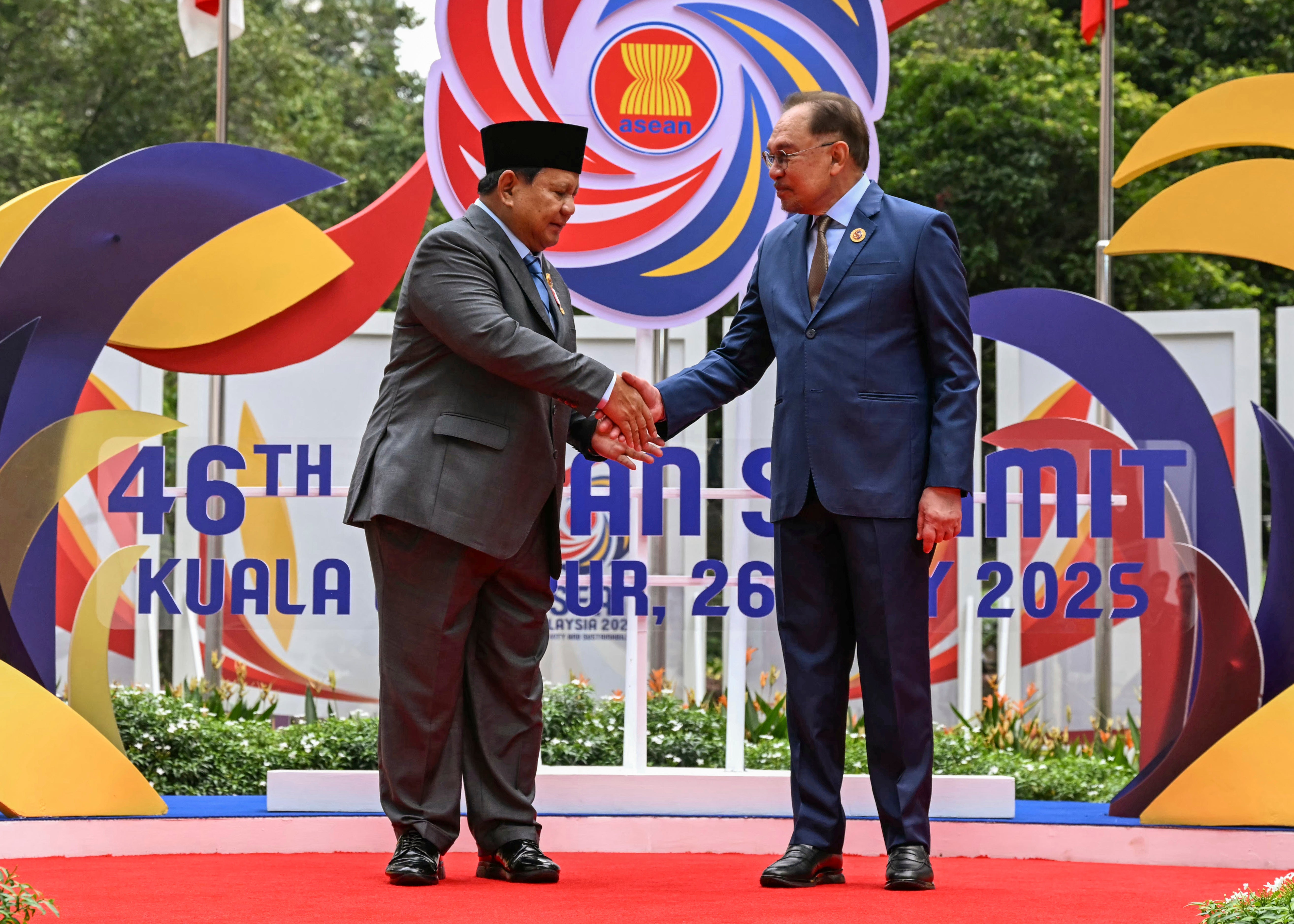 Malaysian prime minister Anwar Ibrahim greets Indonesian president Prabowo Subianto ahead of the Asean summit in Kuala Lumpur on Monday