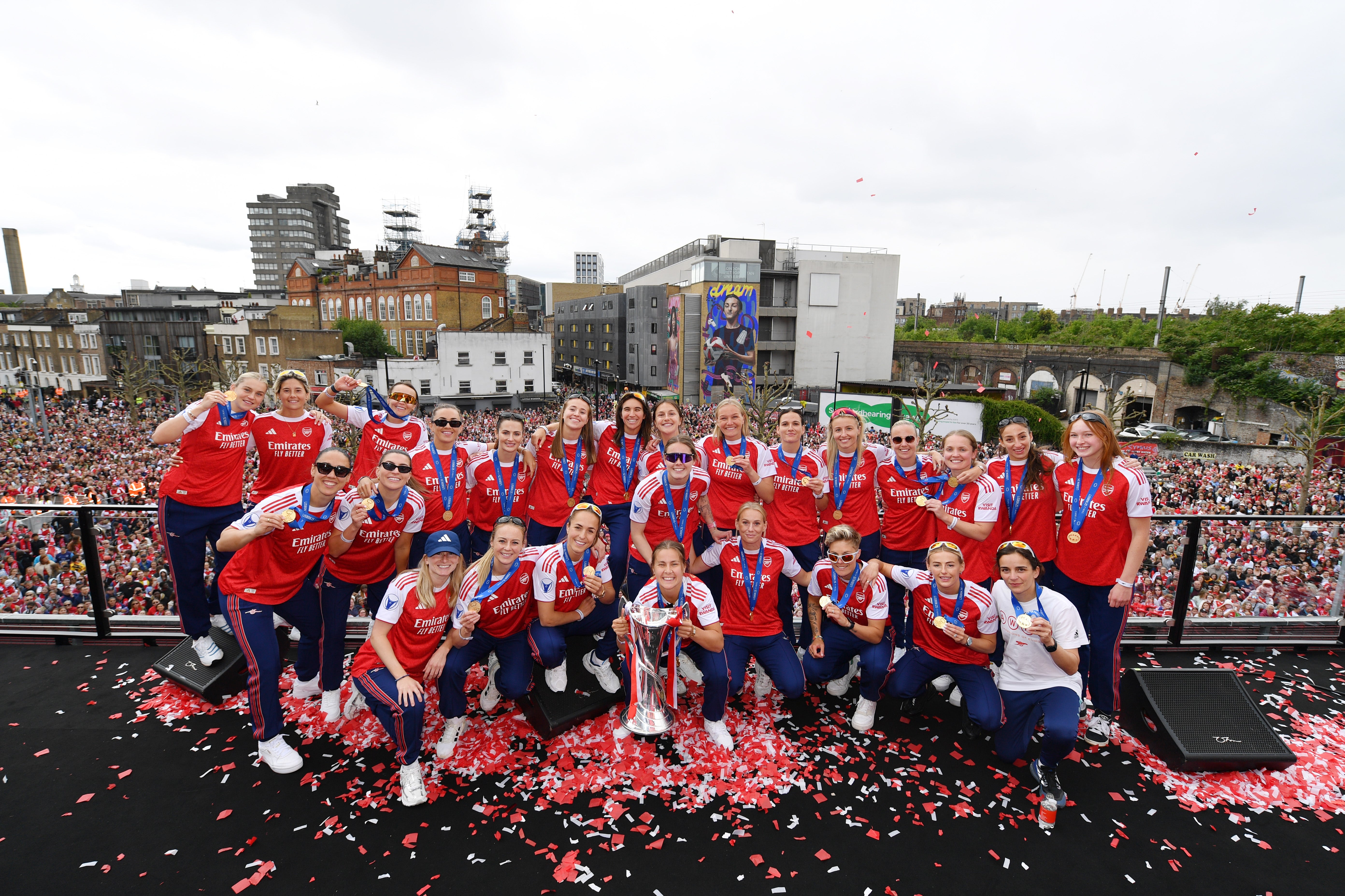 Arsenal celebrate with fans at the Women's Champions League trophy lift