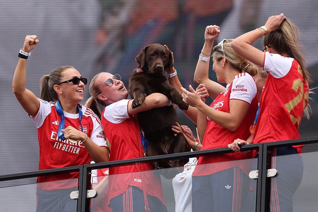Arsenal celebrate with club dog Win