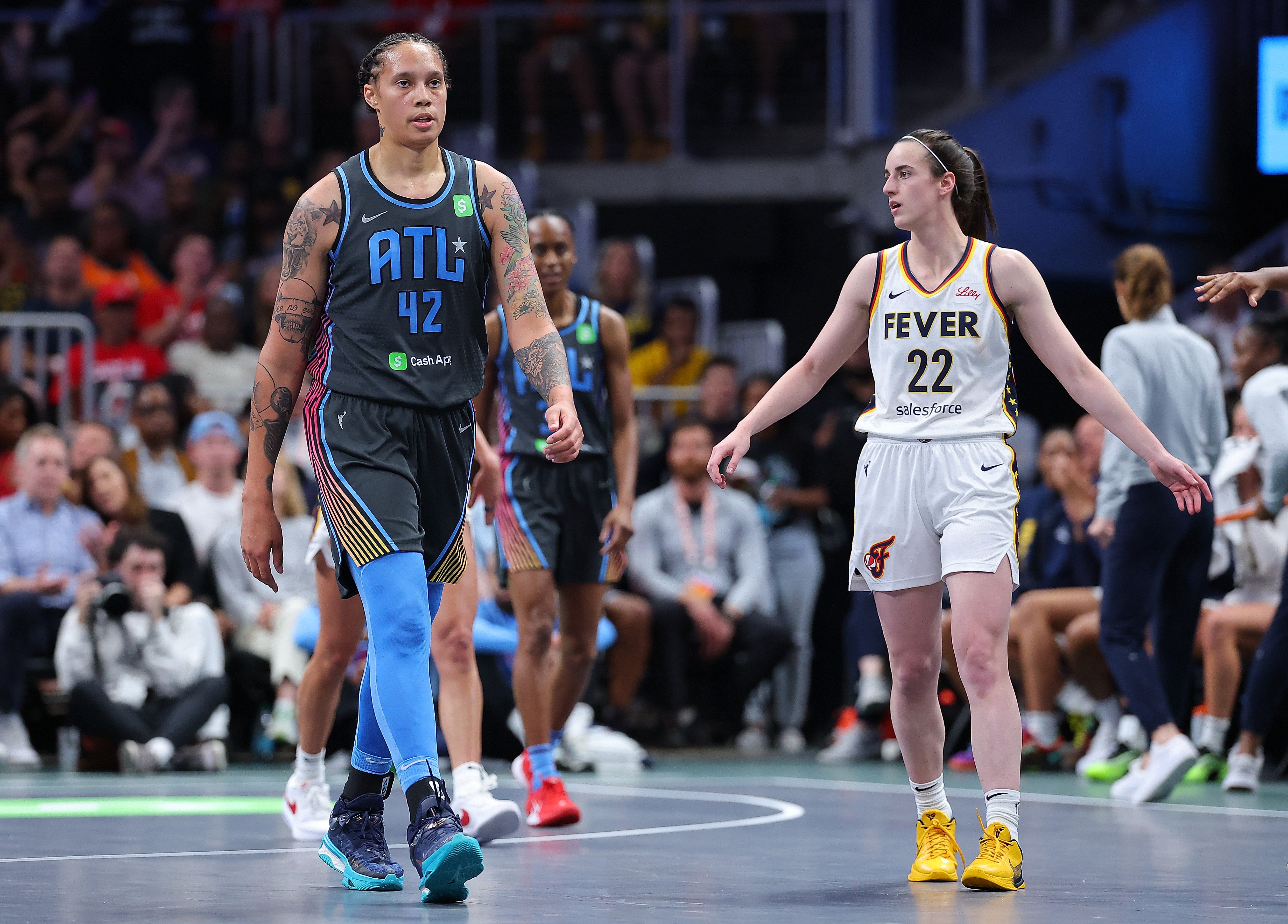 Brittney Griner #42 of the Atlanta Dream reacts after drawing a foul against Caitlin Clark #22 of the Indiana Fever on May 22, 2025