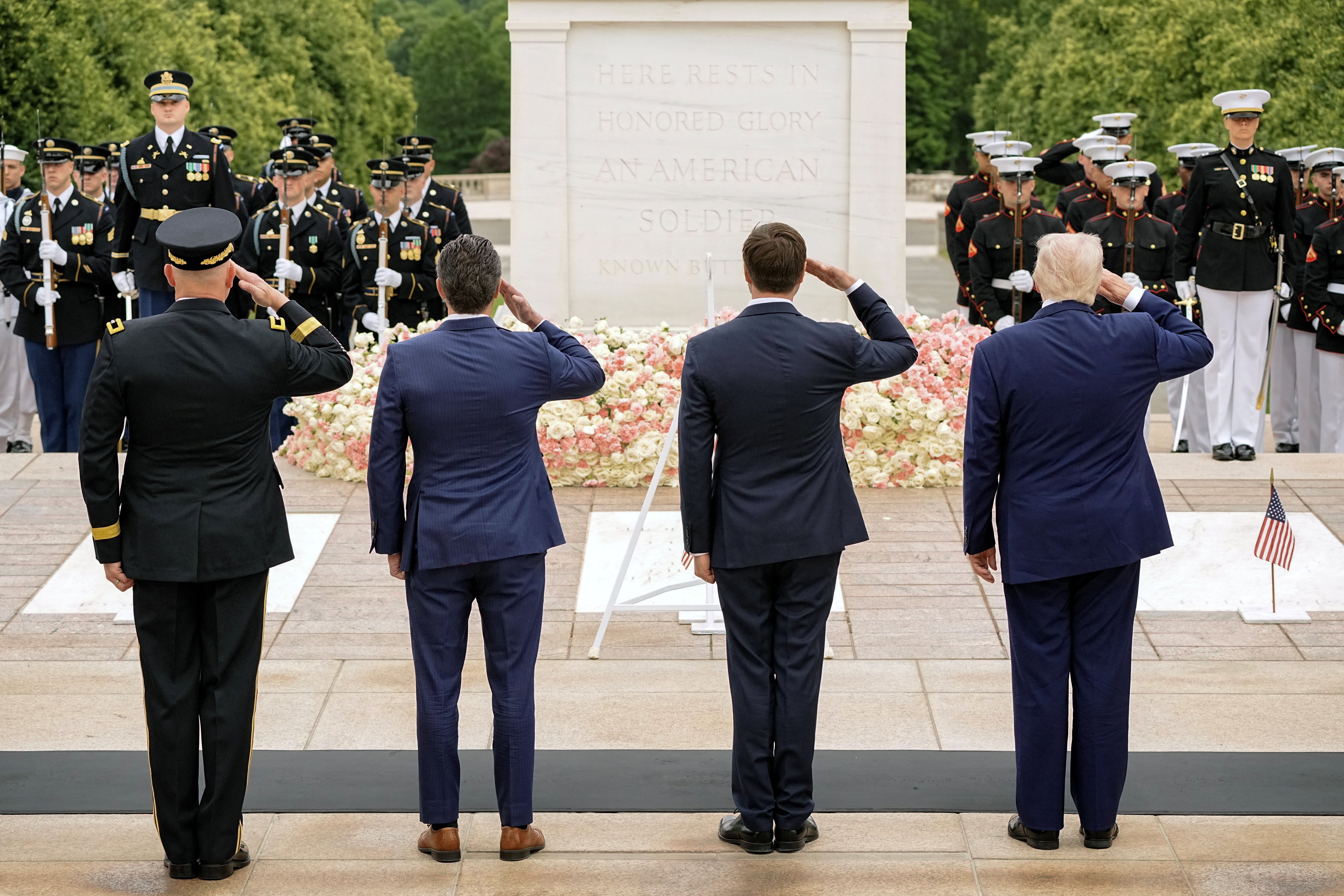 U.S. President Donald Trump and Defense Secretary Pete Hegseth salute by the Tomb of the Unknown Soldier, during ceremonies in commemoration of the Memorial Day holiday, at Arlington National Cemetery in Arlington, Virginia, U.S., May 26, 2025. REUTERS/Ken Cedeno