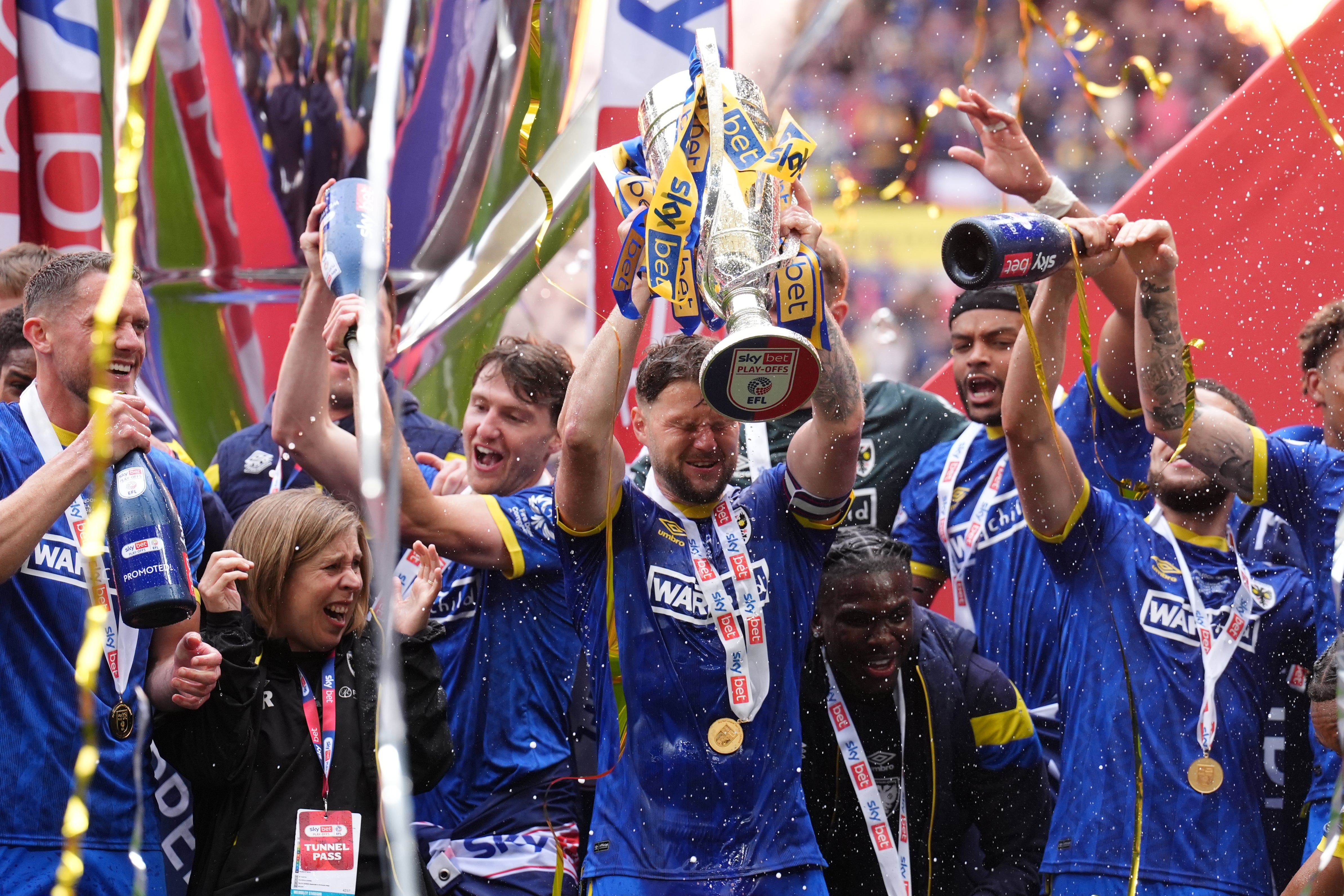 AFC Wimbledon captain Jake Reeves lifts the trophy after the Sky Bet League Two play-off final at Wembley Stadium