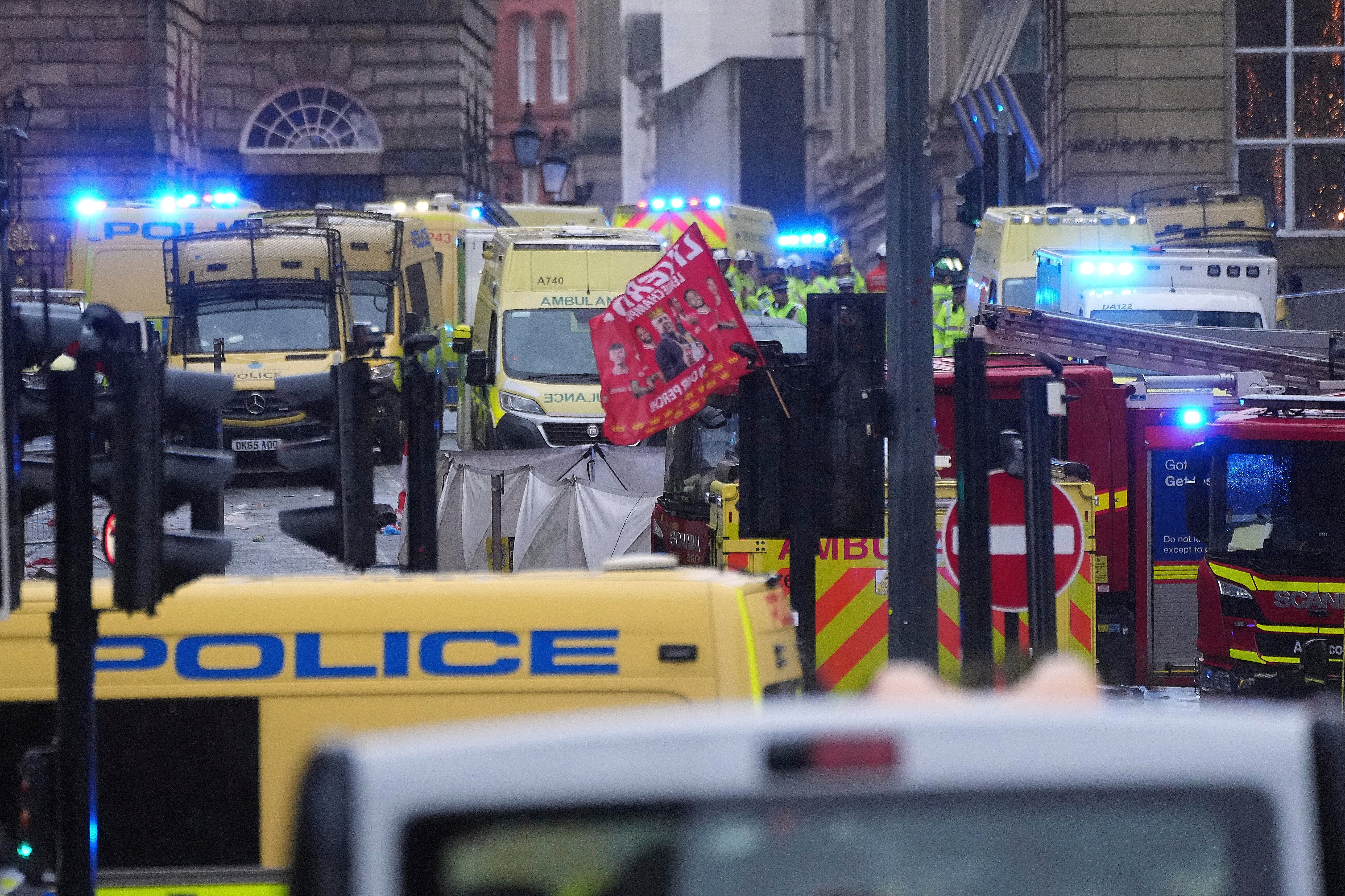 Police and emergency personnel deal with an incident near the Liver Building during the Premier League winners parade in Liverpool, Monday, May 26, 2025