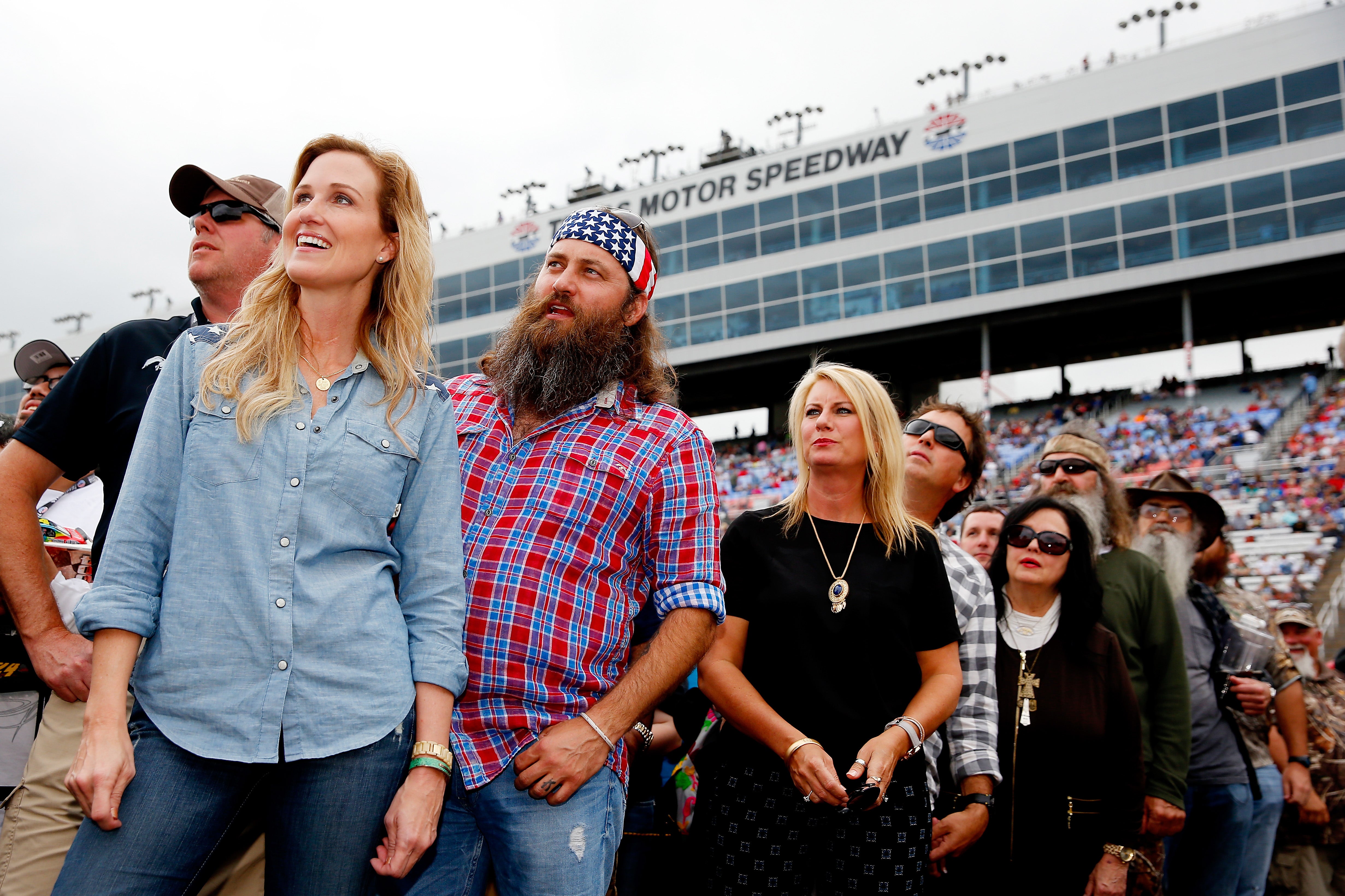 From left, Korie Robertson, Willie Robertson, Lisa Robertson, Alan Robertson, Kay Robertson, Phil Robertson and Si Robertson of Duck Dynasty at the NASCAR Sprint Cup Series Duck Commander 500 in 2015
