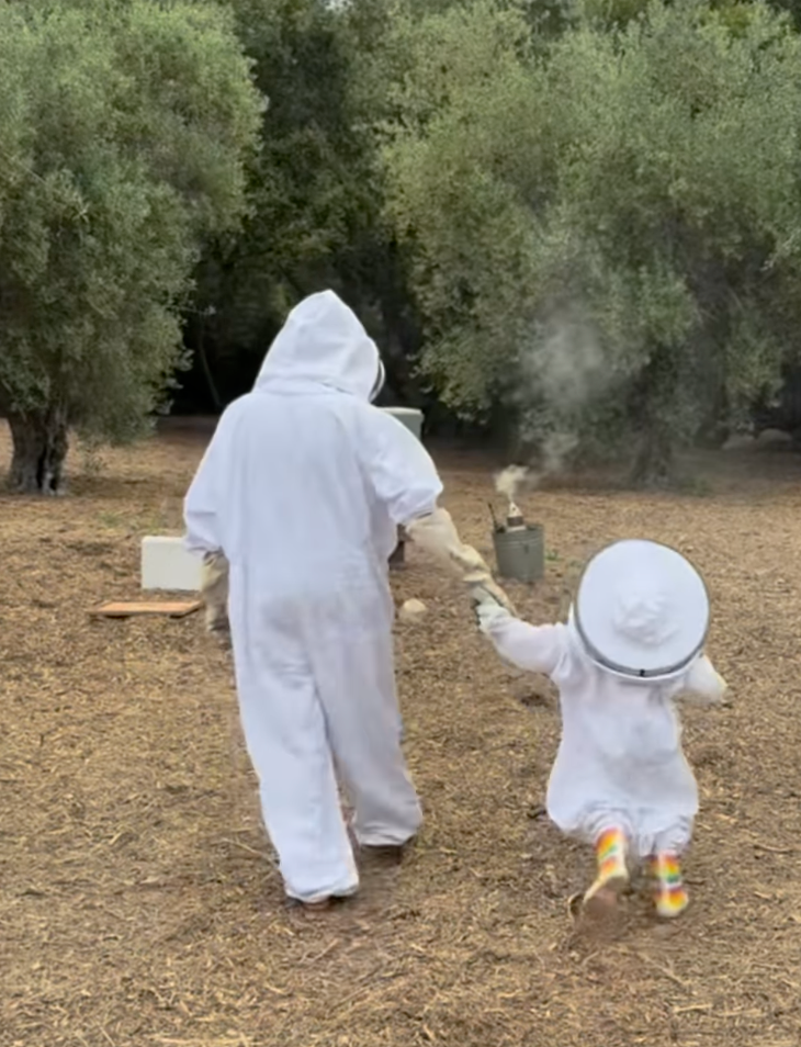 Meghan with her daughter Lilibet in beekeeping outfits