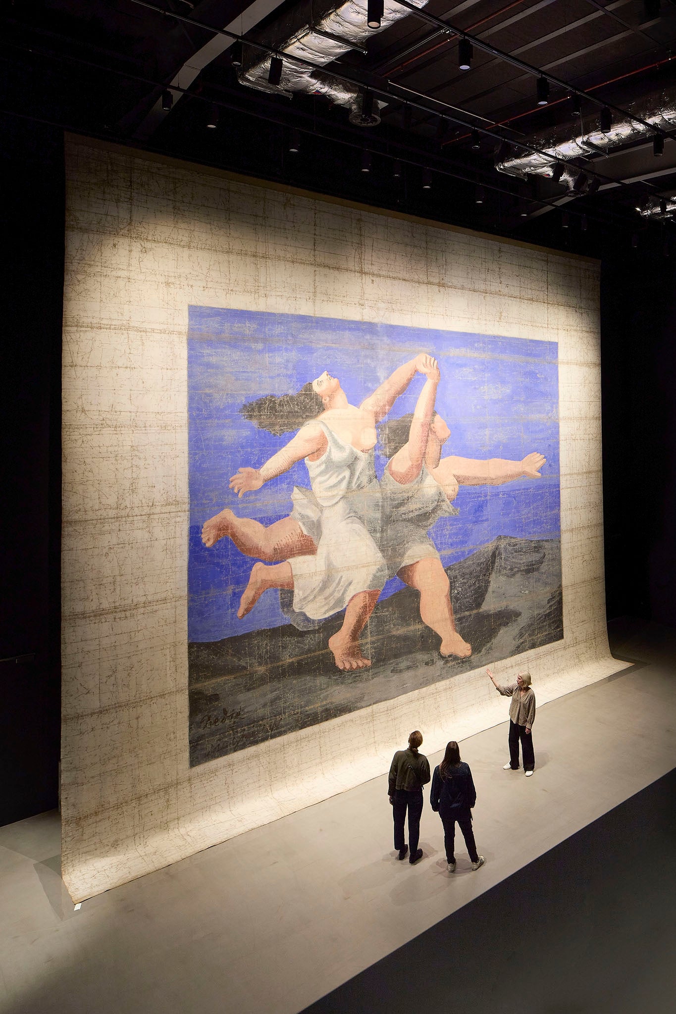 A giant Picasso painting is shown at the new V&A museum in Stratford