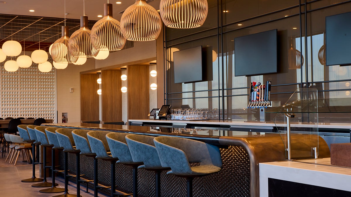 Seating options include café chairs, bar stools, lounge seats and private work pods. Above is the Flagship lounge bar