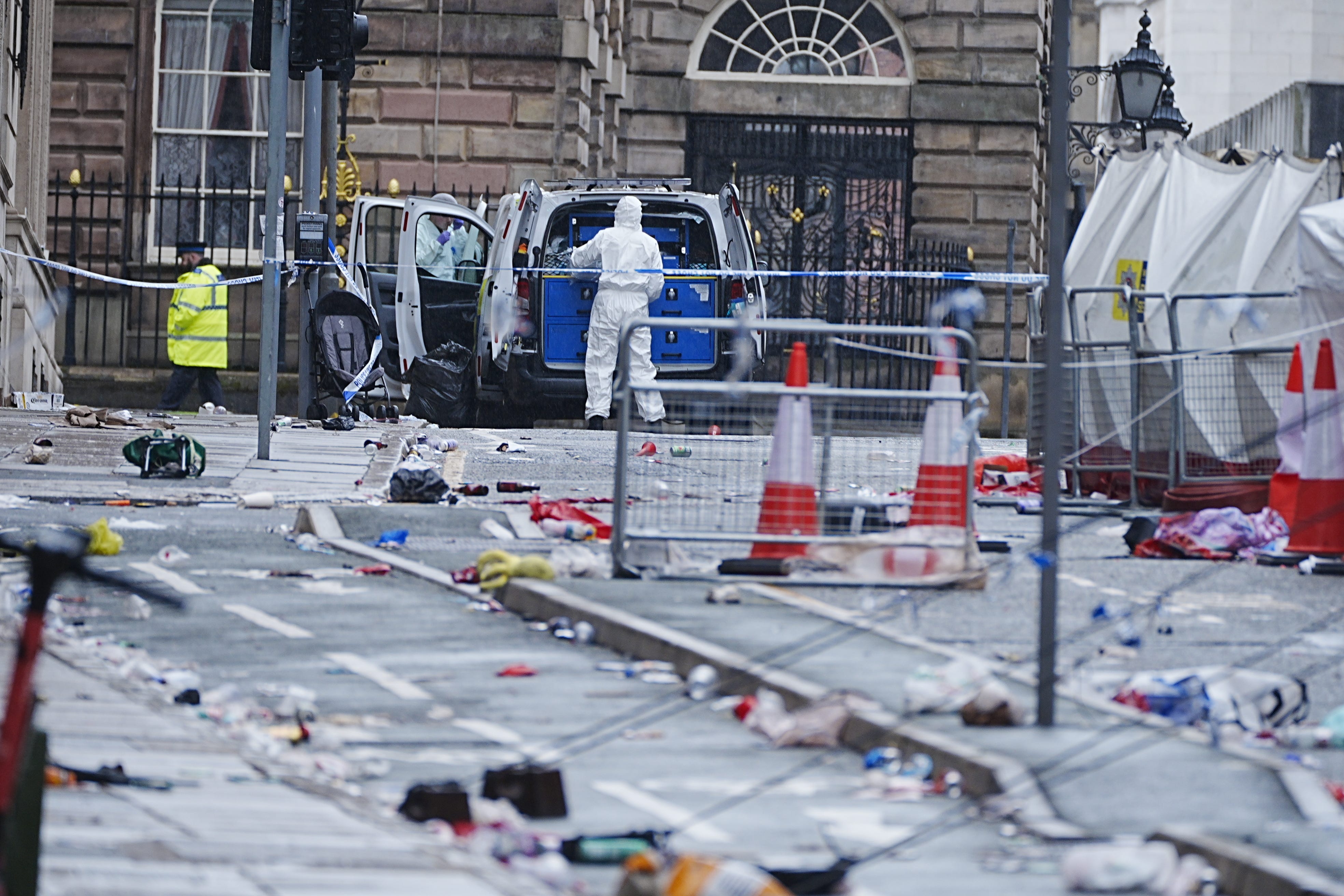 Forensic officers at the scene in Water Street near the Liver Building in Liverpool (Peter Byrne/PA)