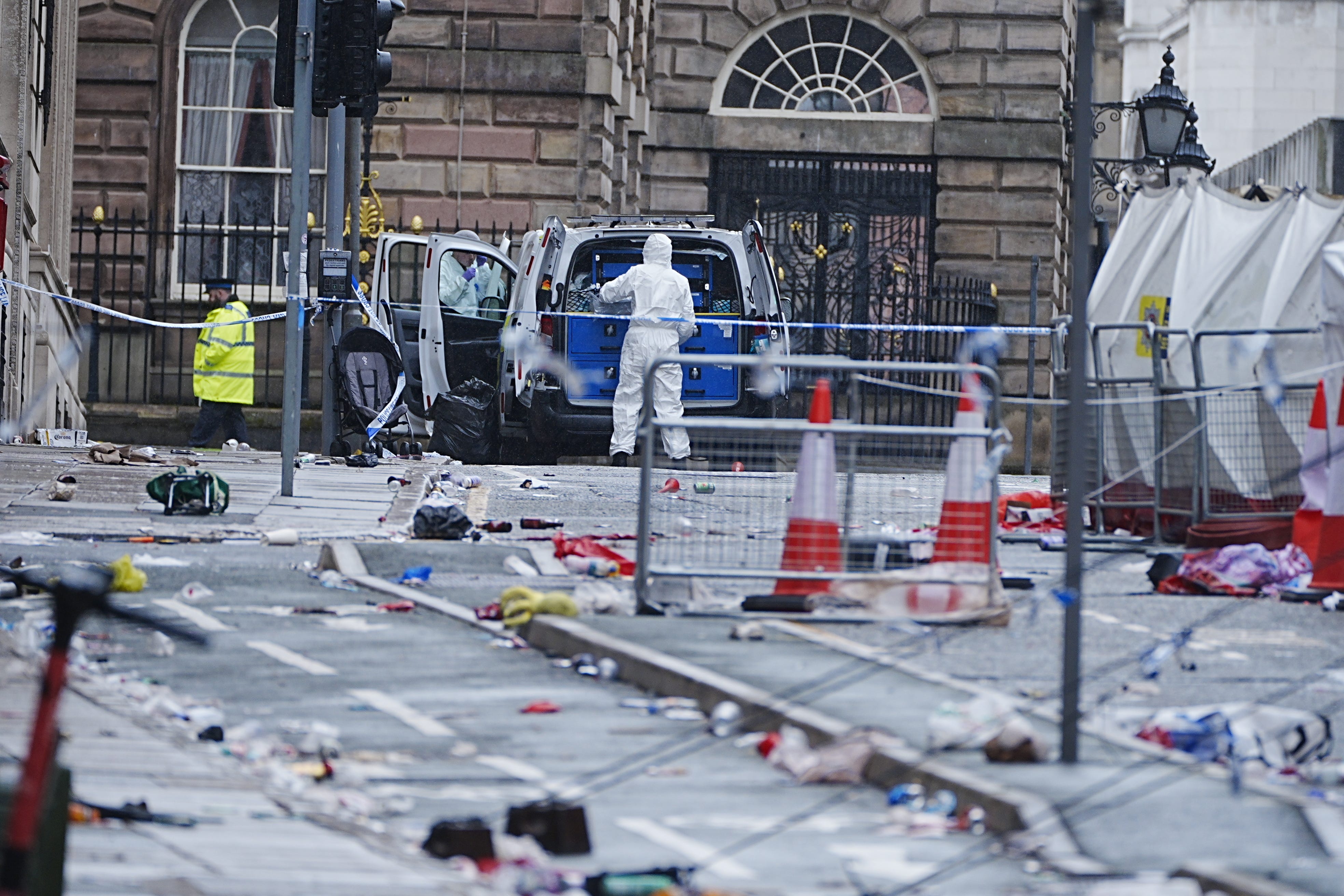 Forensic officers at the scene in Water Street near the Liver Building (Peter Byrne/PA)