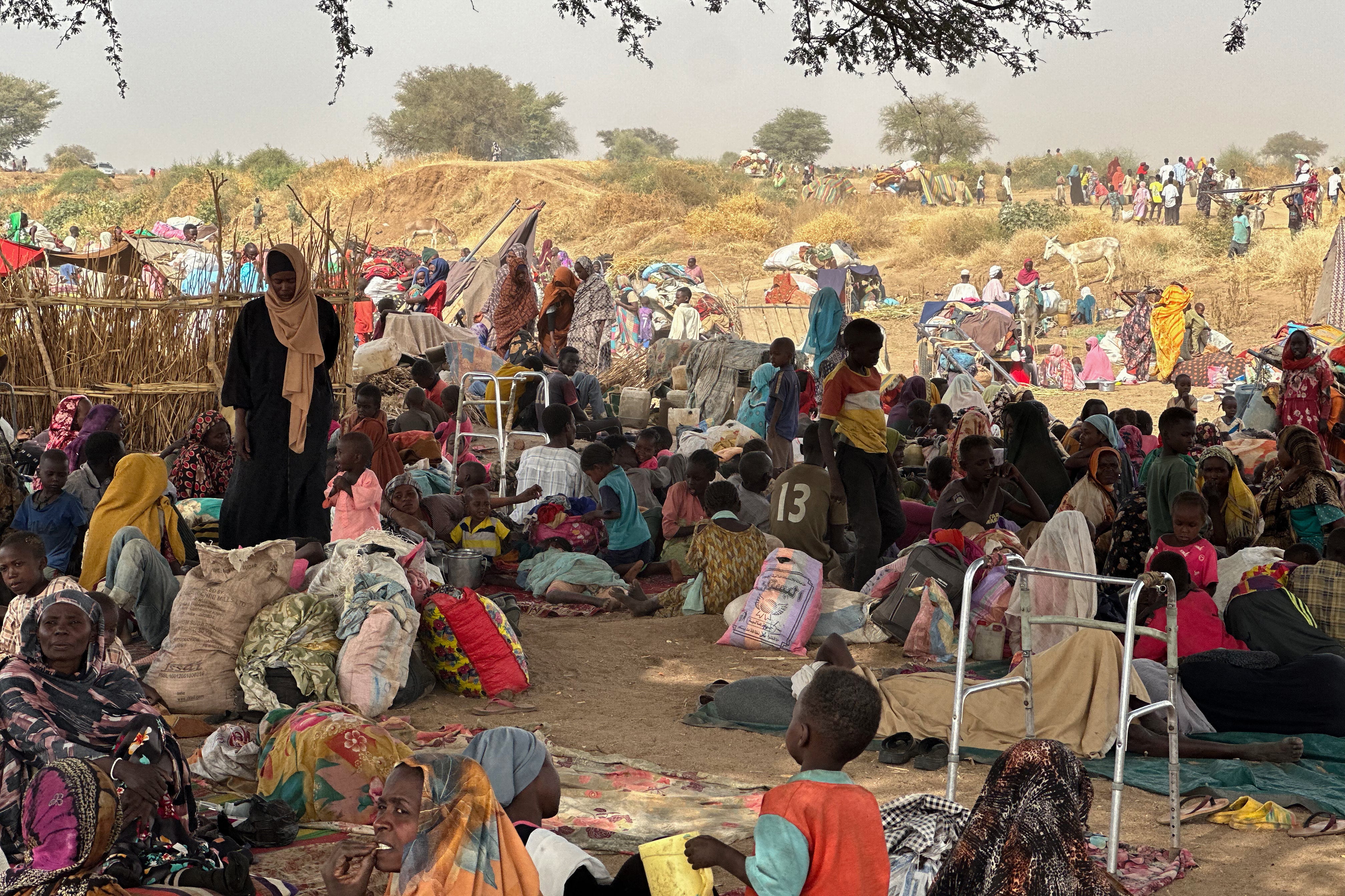 People who fled the Zamzam camp after it fell under RSF control, rest in a makeshift encampment in Sudan's western Darfur region