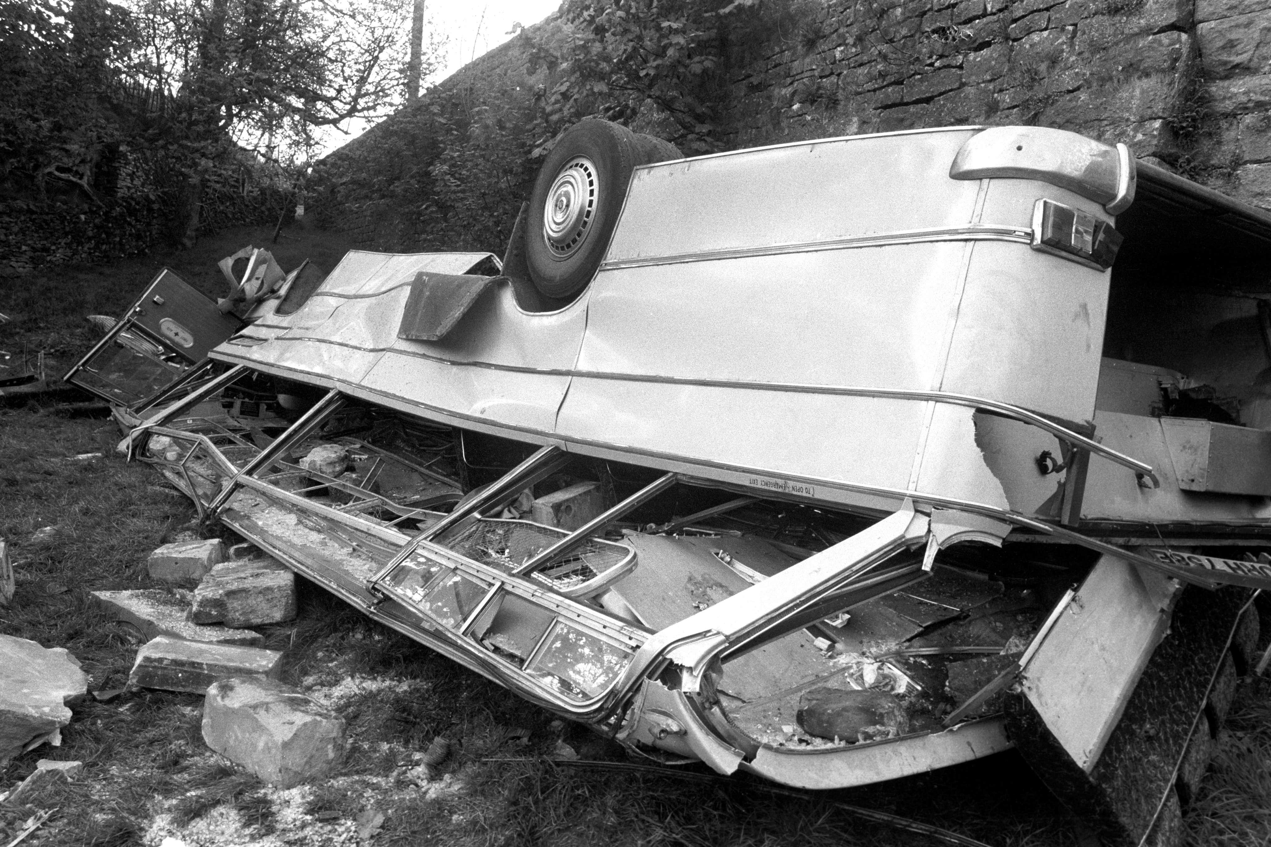 The remains of the almost flattened coach, in which 32 passengers died, after it crashed through the parapet of Dibbles Bridge, Hebden, Yorkshire. The coach was carrying a sightseeing group from Teeside.