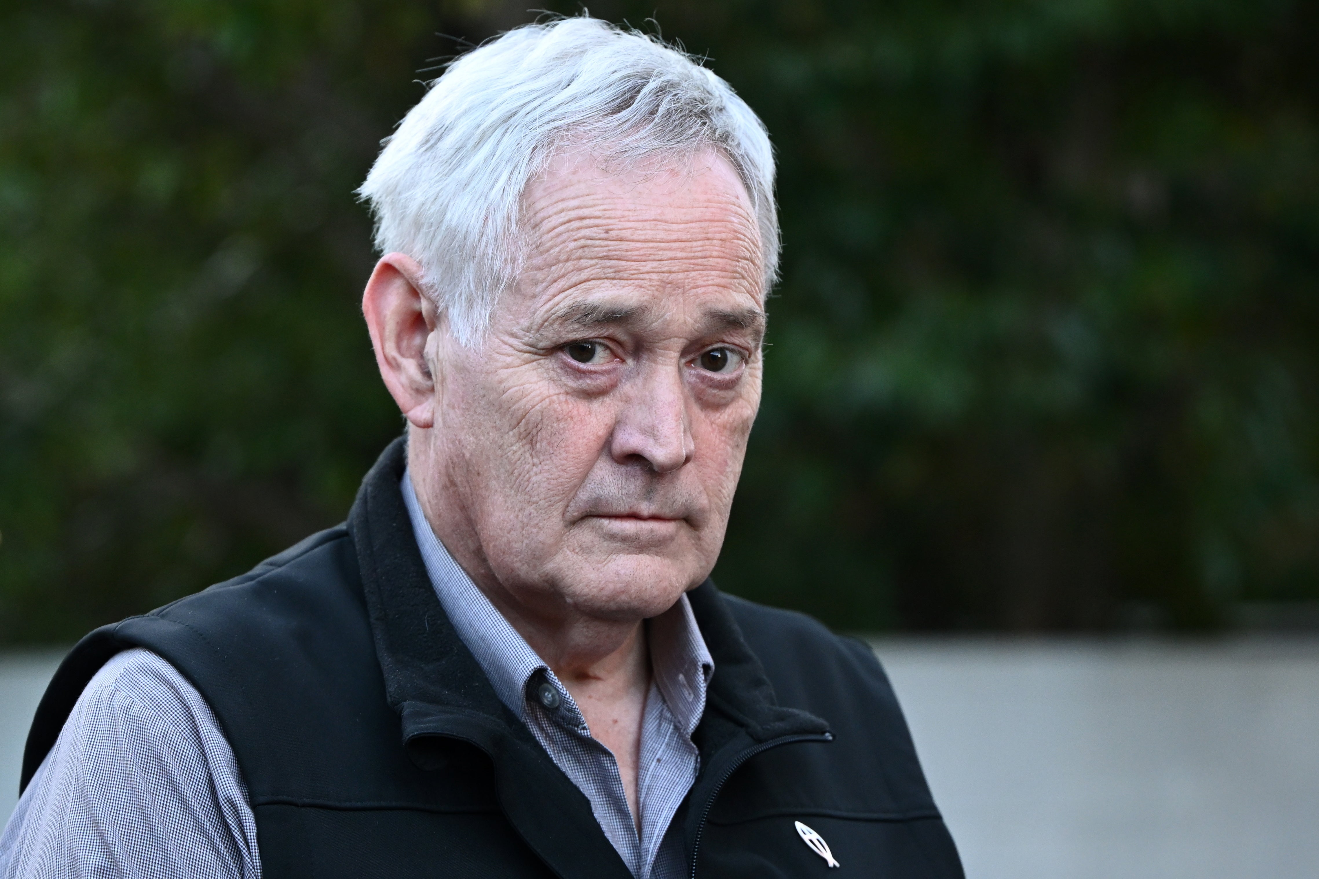 Ian Wilkinson, the only surviving guest of a lunch at Erin Patterson's house, leaves after testifying at the Supreme Court in Victoria, Australia