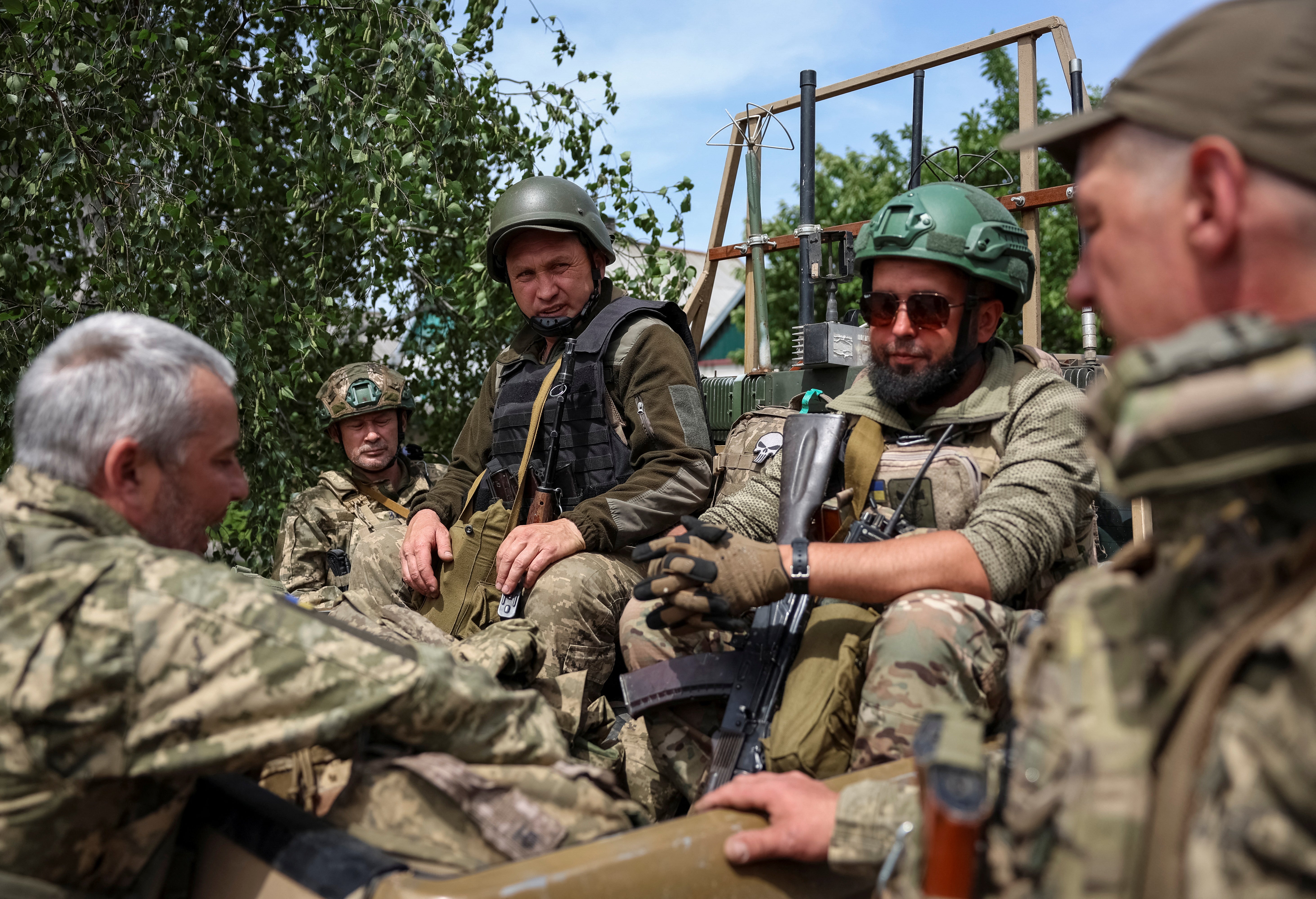Ukrainian soldiers prepare to ride into combat near the town of Pokrovsk in Donetsk region, Ukraine