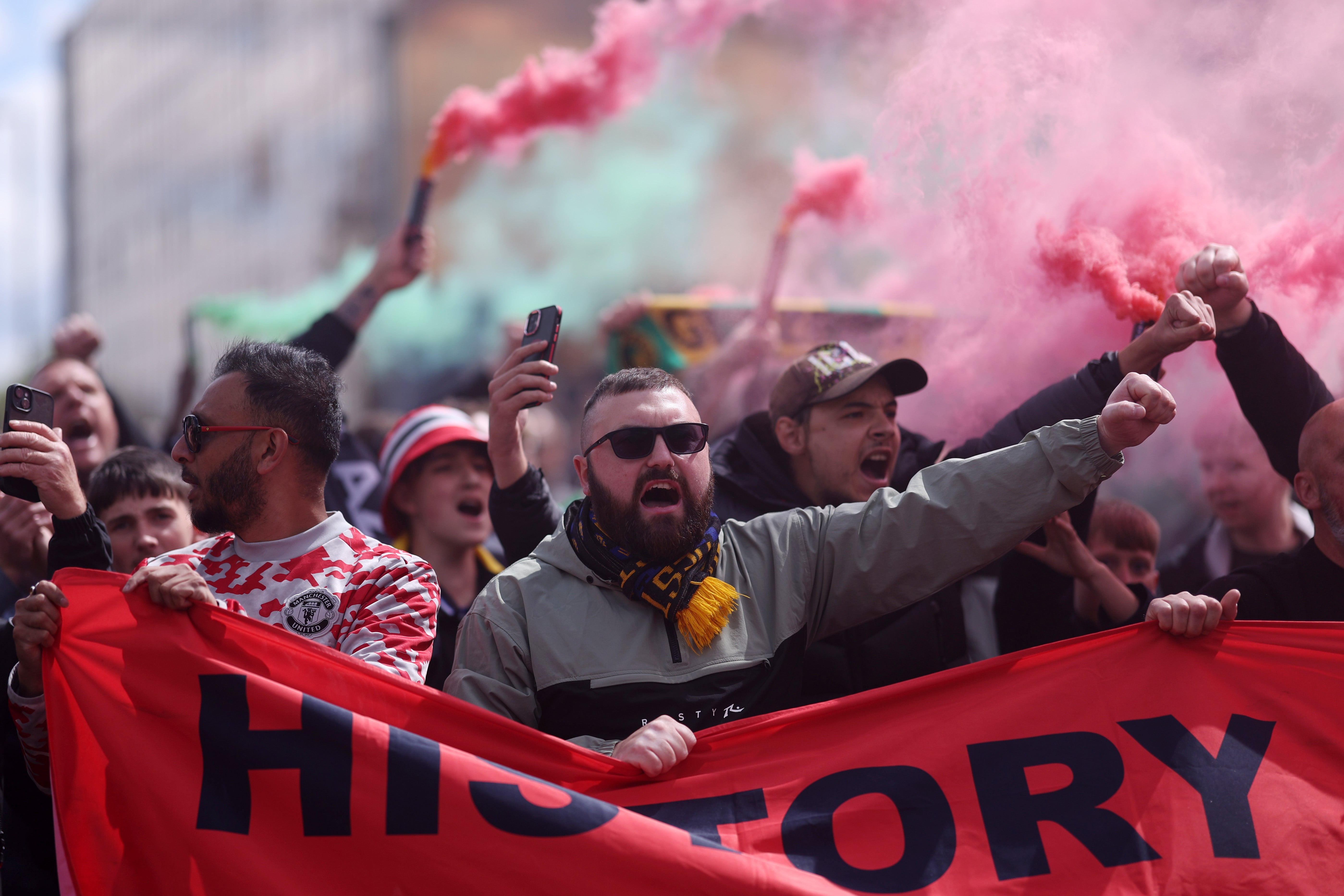 Fans of Manchester United protest against the club's owners outside the stadium before facing Aston Villa