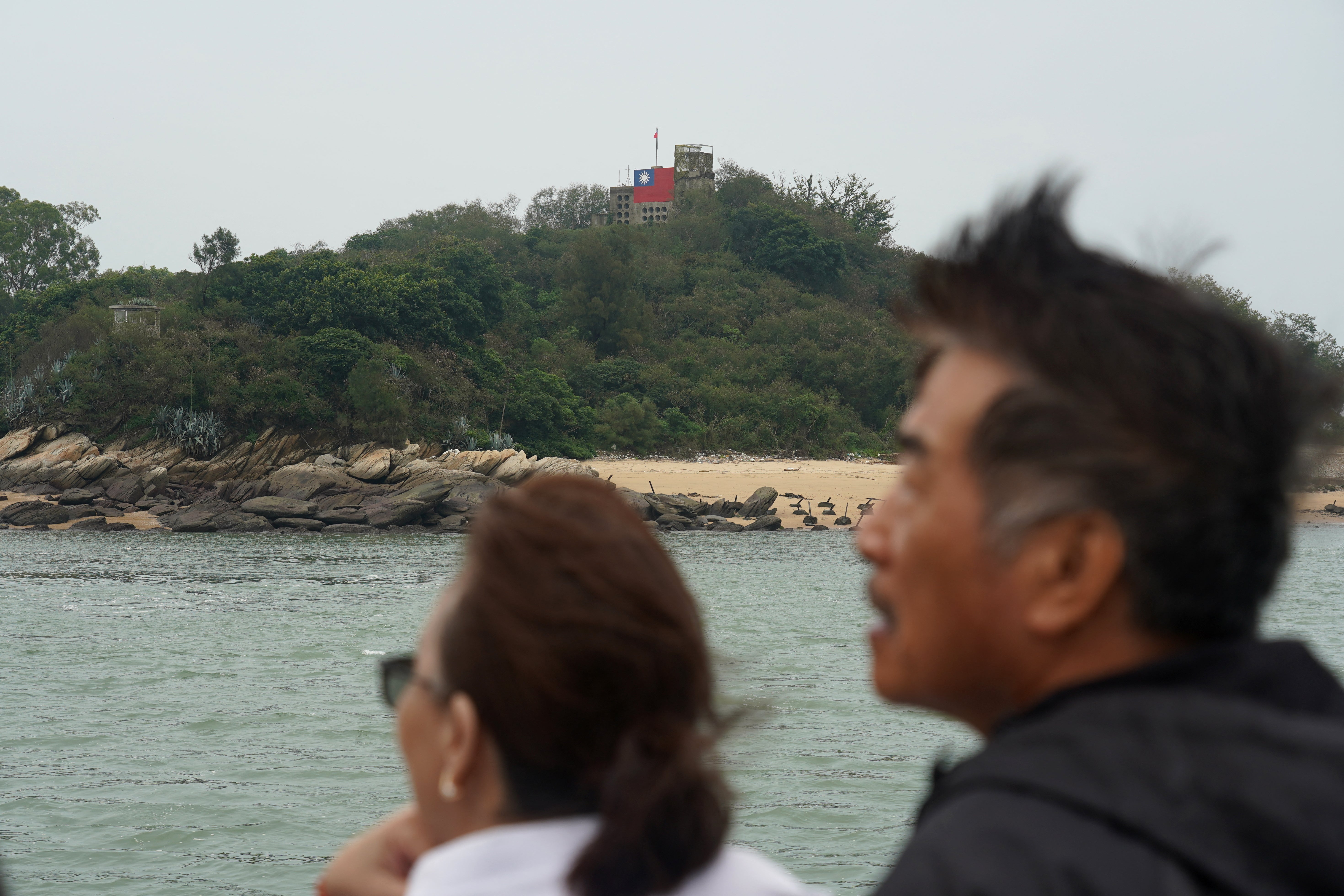 A Taiwan flag is seen on a small island during a boat tour around the islands of Kinmen