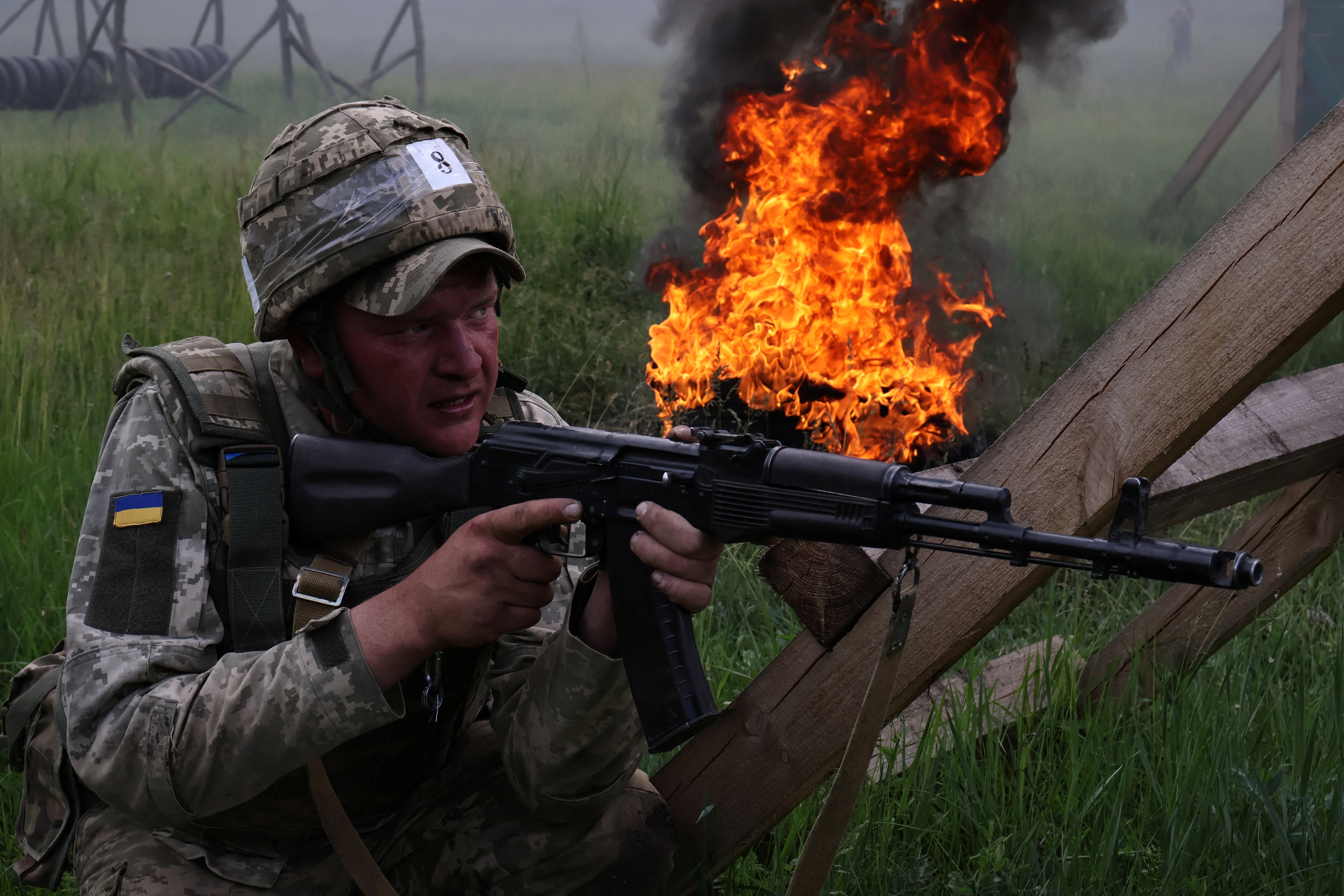 A Ukrainian soldier attends a military drill as a recruit near a front line in the Zaporizhzhia region, Ukraine