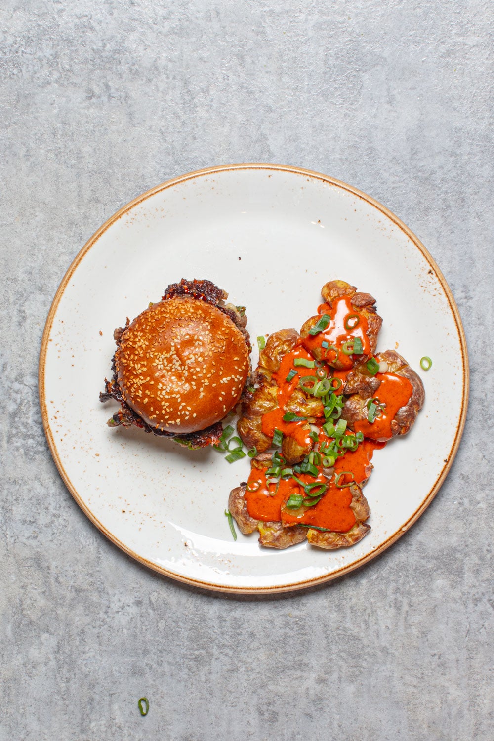 A fiery glaze, melty cheddar and crisp potato salad bring big takeaway energy without the spend