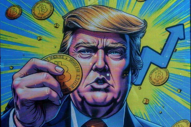 <p>A cryptocurrency exchange office with a screen featuring US President Donald Trump holding cryptocurrency coins in Hong Kong on 12 March, 2025</p>