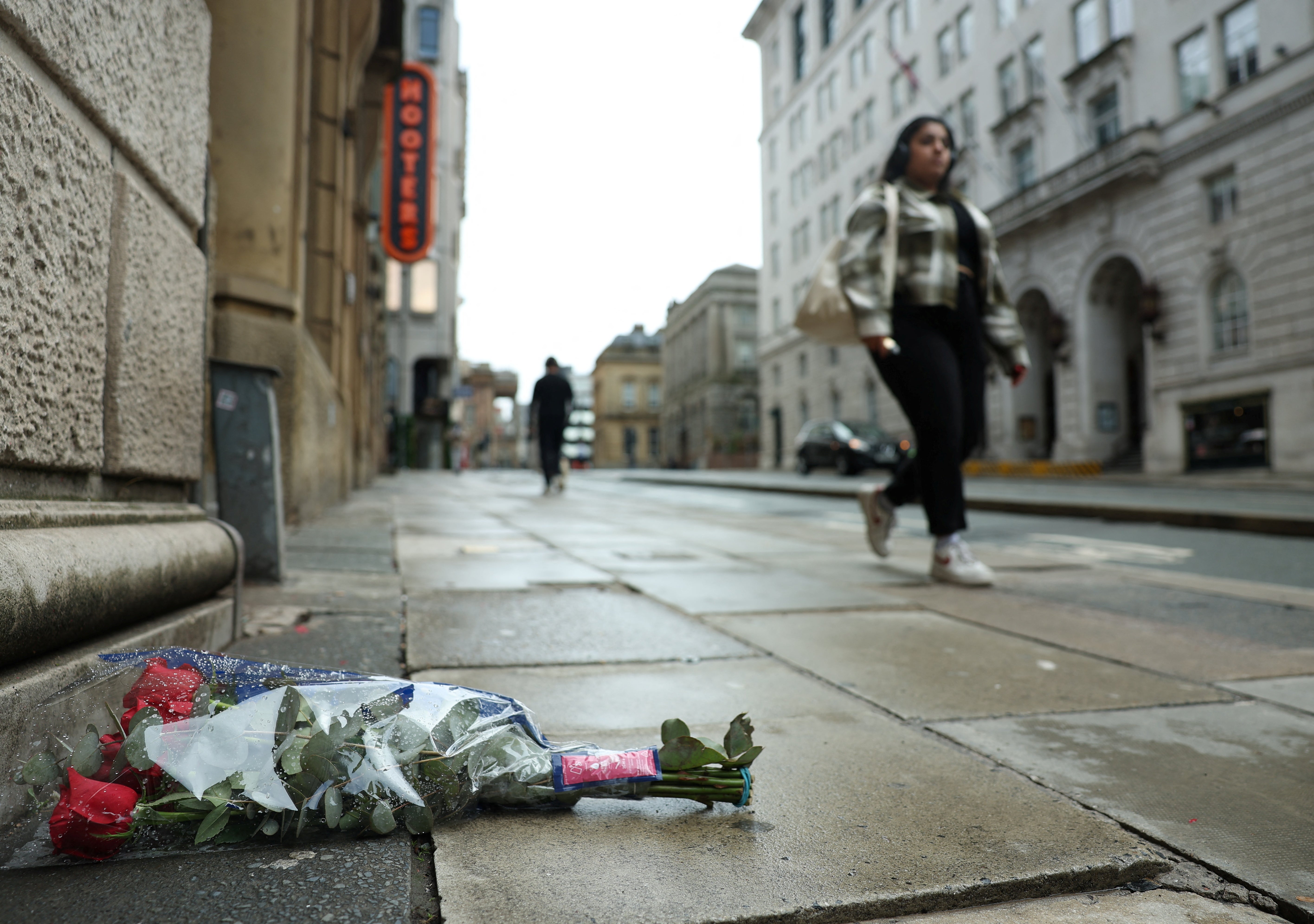 Flowers lie at Water Street by the site of an incident where a car plowed into a crowd of Liverpool fans during a parade celebrating their side's Premier League soccer title, in central Liverpool, Britain, May 28, 2025