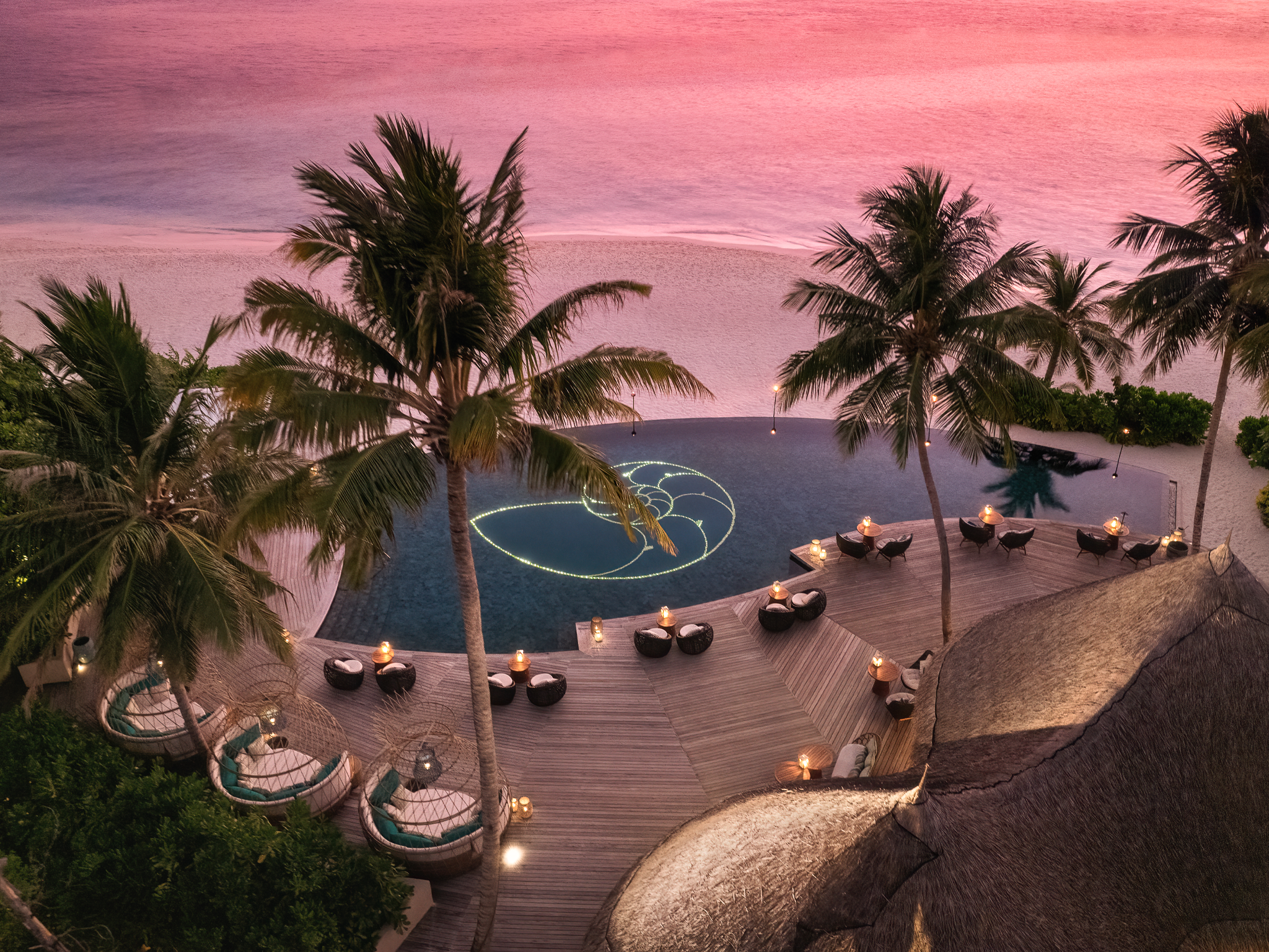 Complimentary cocktails and canapes are available by the pool between sunset hours, soundtracked by live music