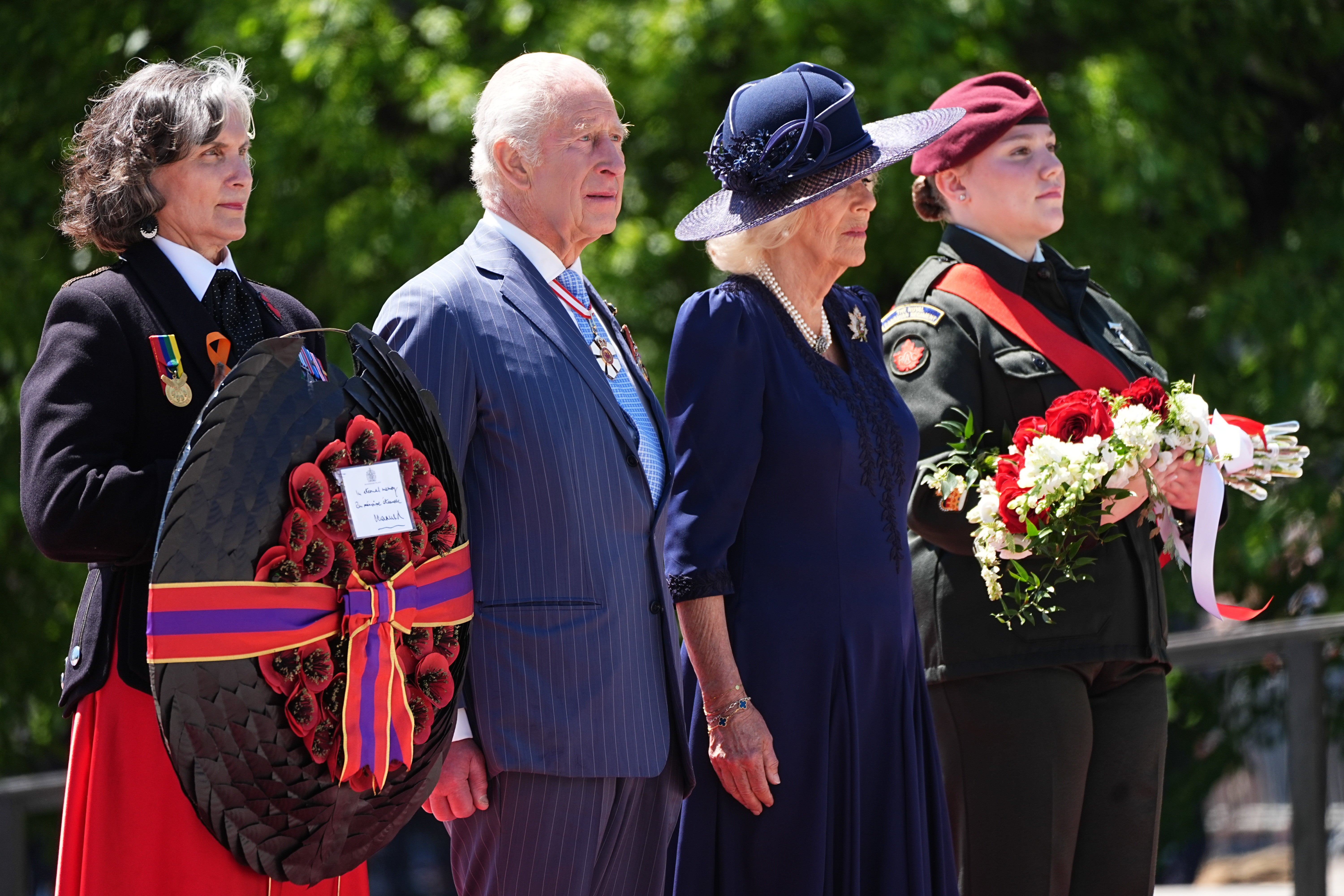 The King and Queen left floral tributes at the Tomb of the Unknown Soldier in front of the National War Memorial, Ottawa