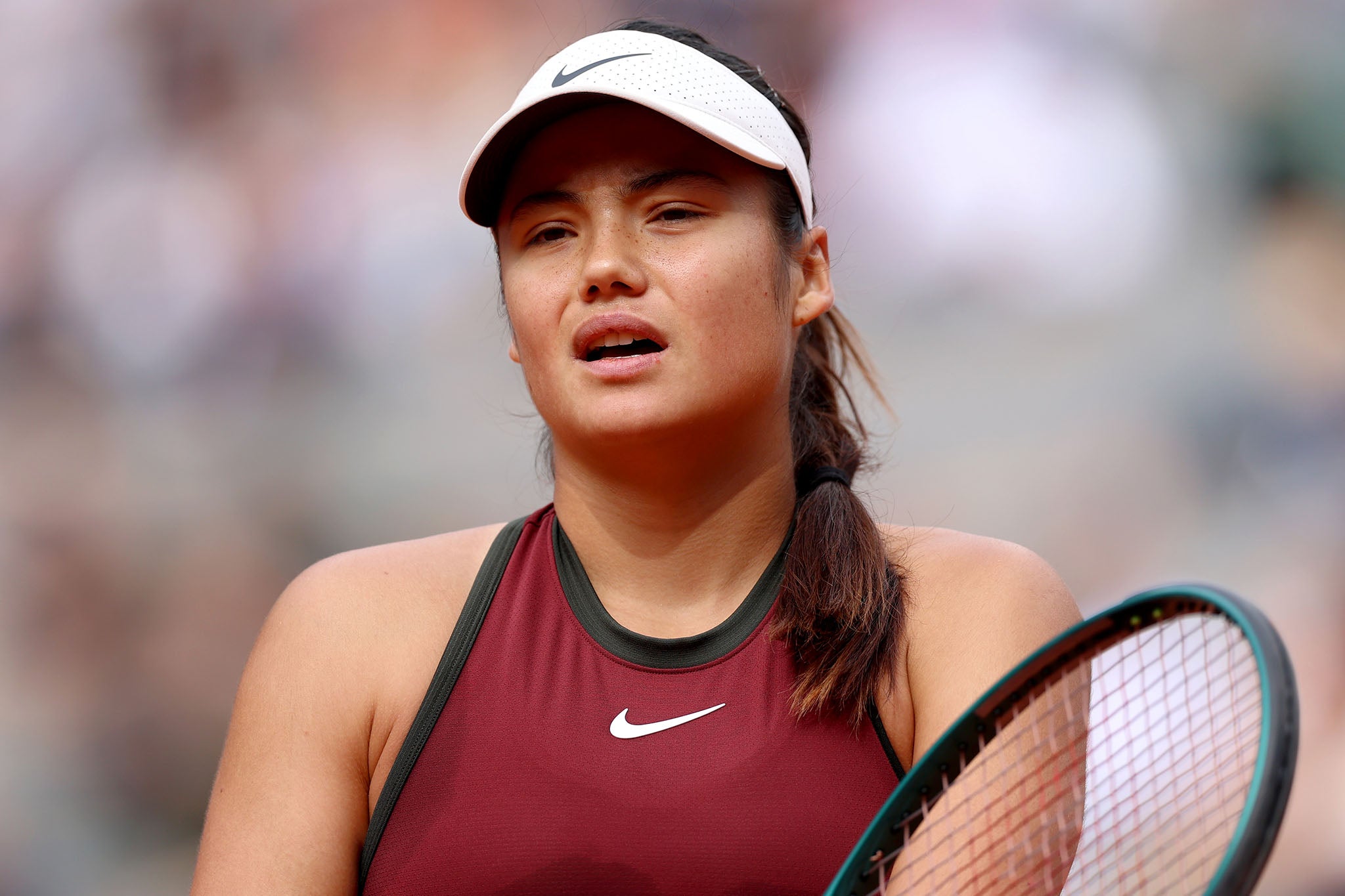 Emma Raducanu plays against Iga Swiatek of during the Women's Singles Second Round match at the French Open