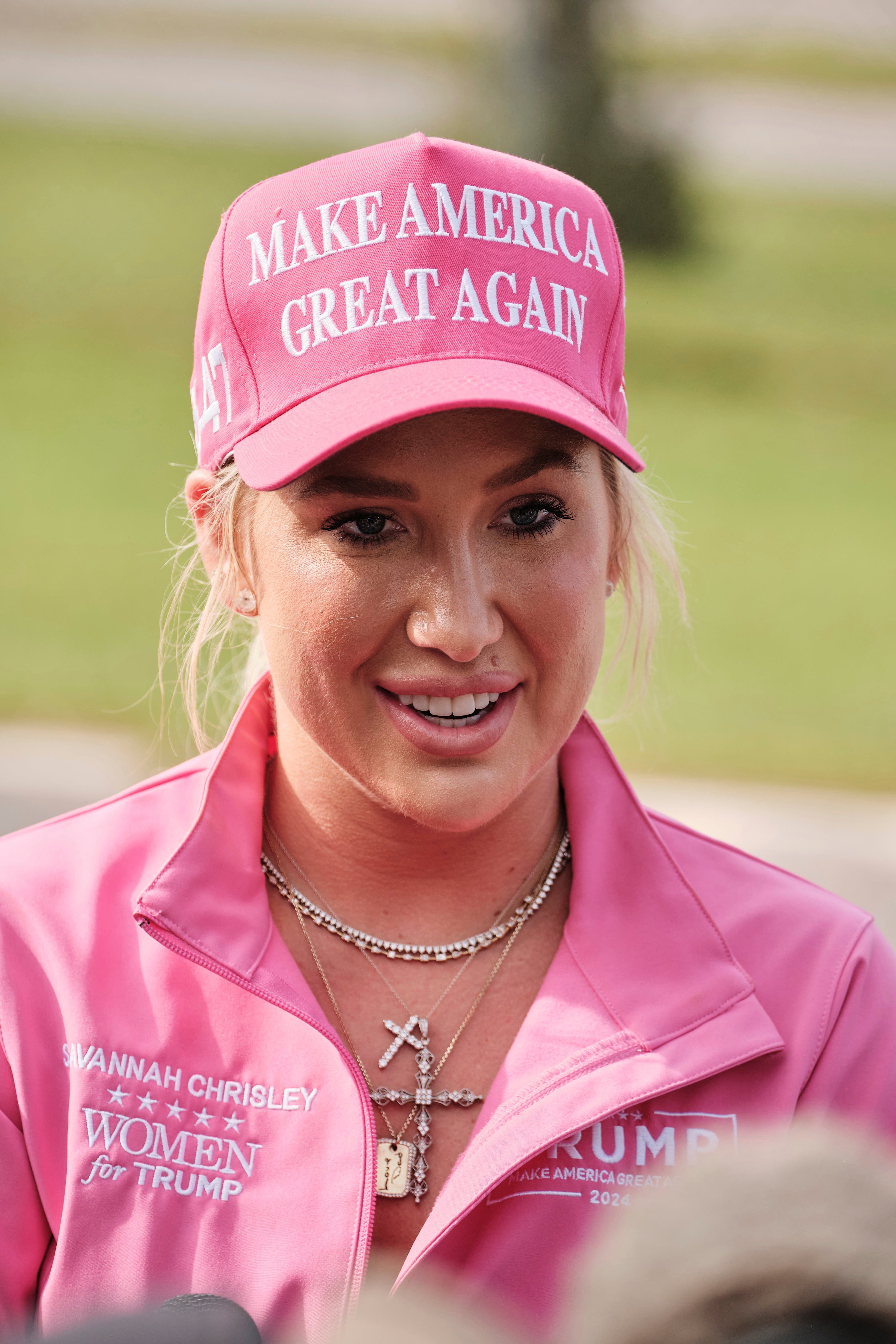 ‘It’s all God and President Trump:’ Chrisleys’ daughter gushes as she watches dad walk free from prison after Trump pardon for reality TV couple