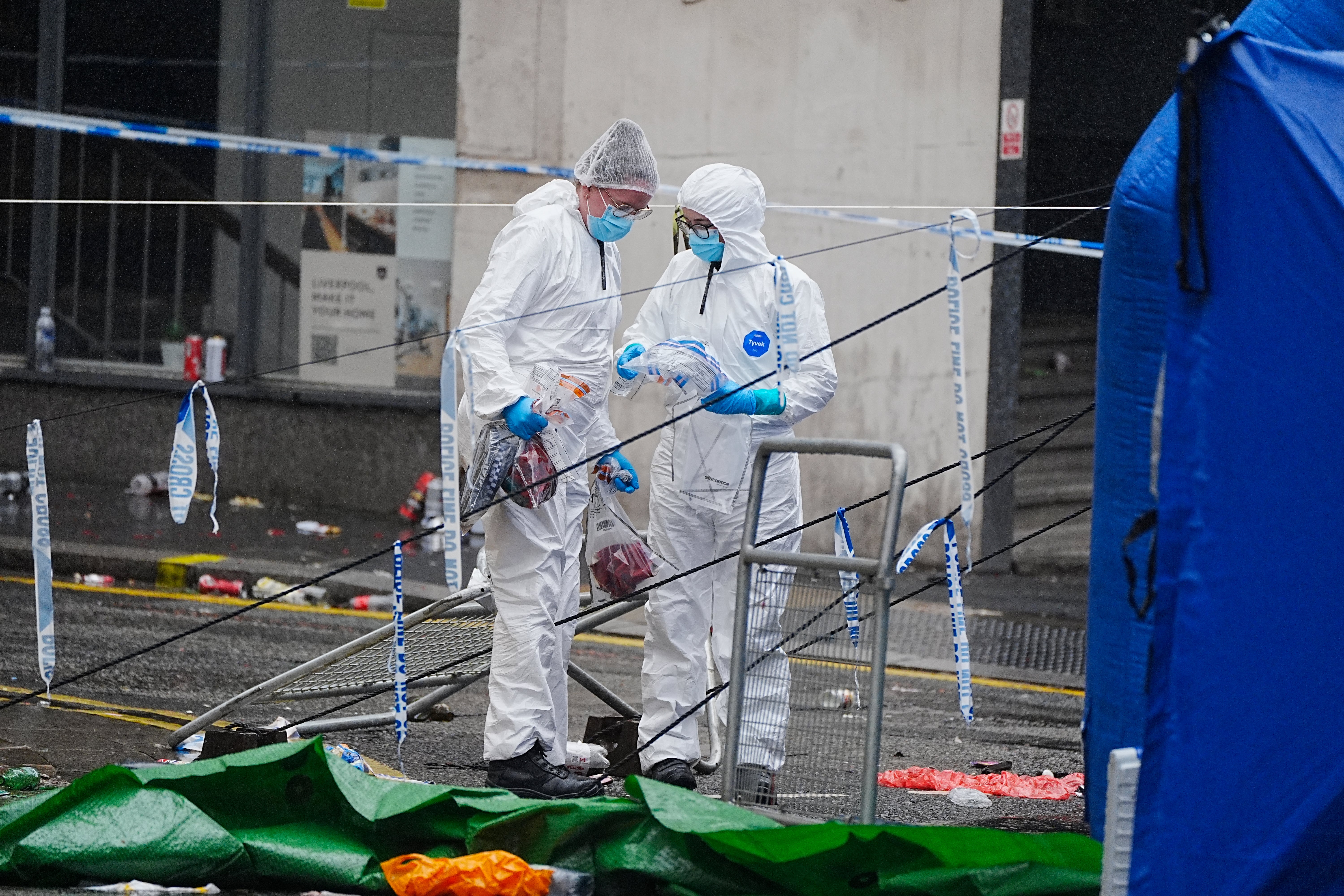 Forensic teams scour the road for evidence as part of Merseyside Police’s investigation into the incident on Water Street