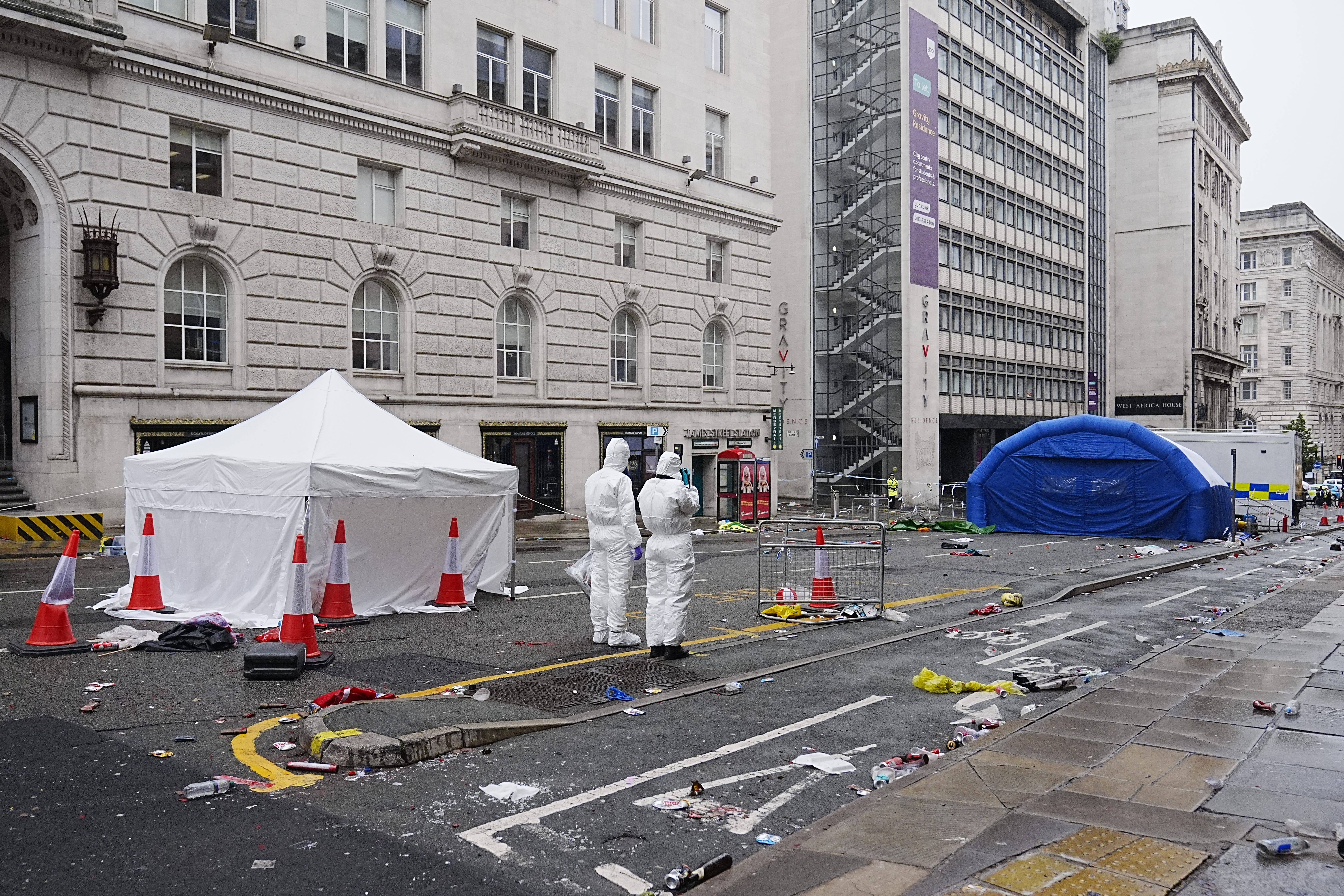 Forensic officers have been working at the scene in Water Street near the Liver Building in Liverpool (Peter Byrne/PA)