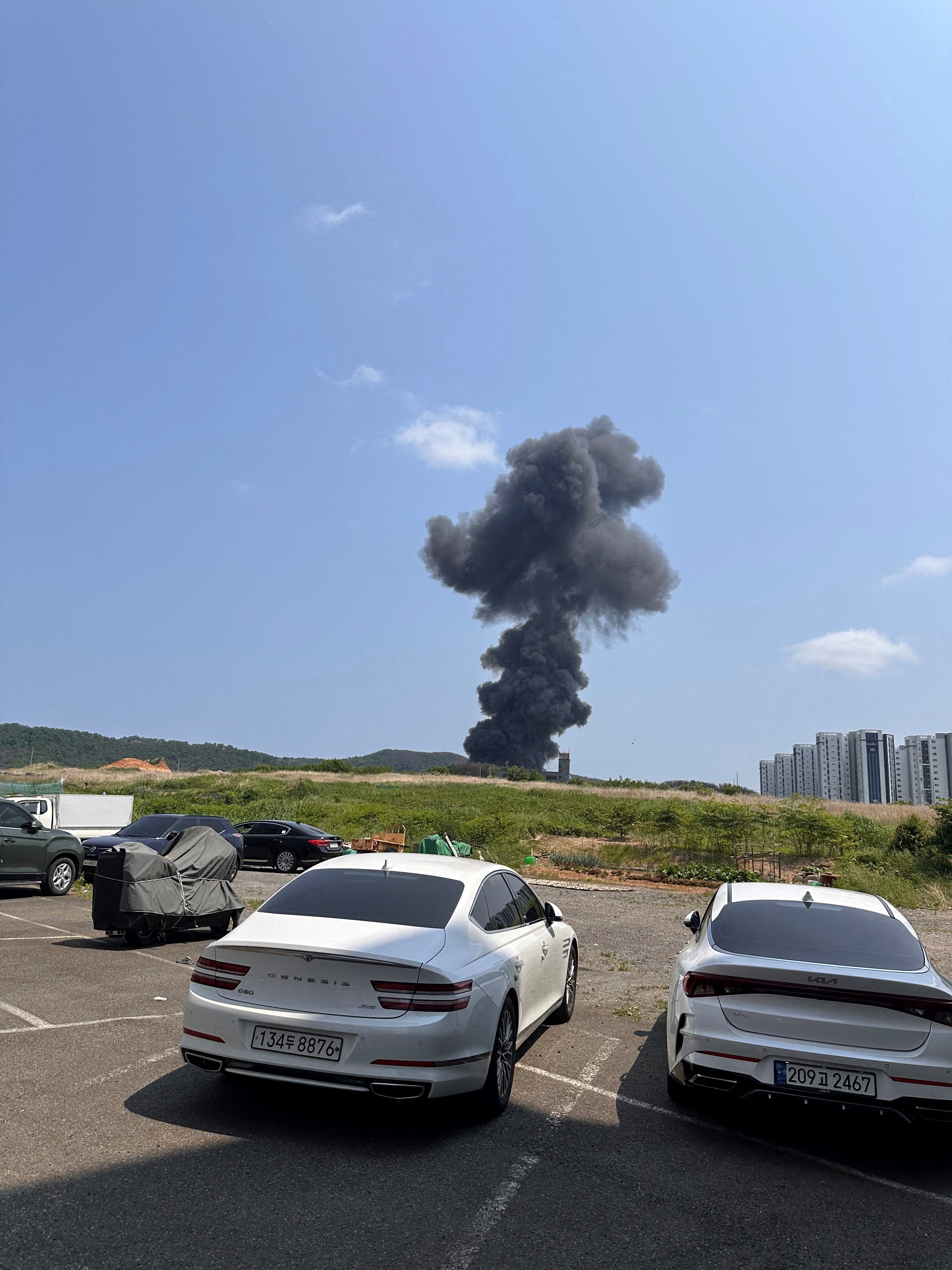 A general view shows smoke billowing after a South Korean navy maritime patrol aircraft crashed