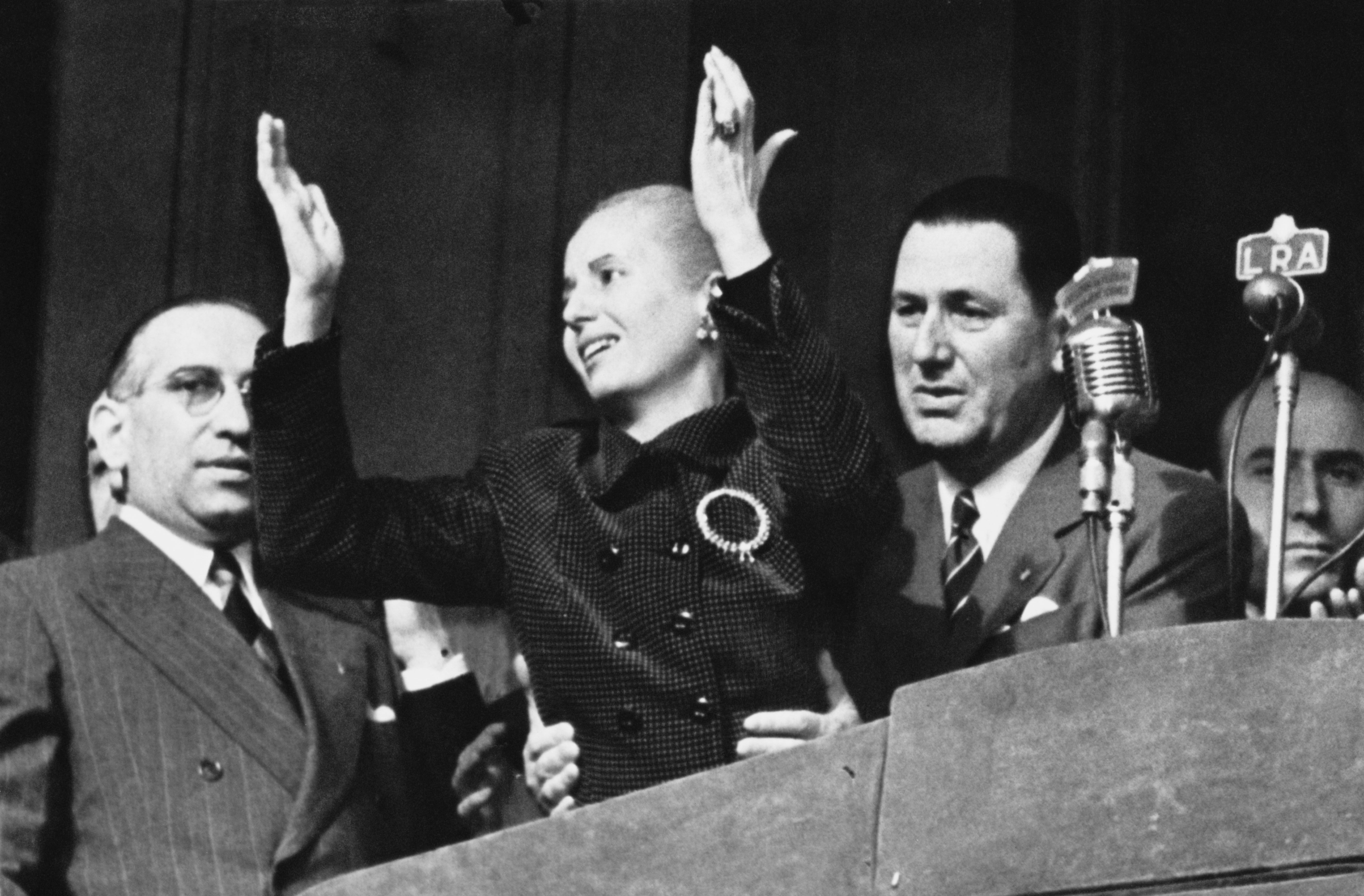 Power couple: Eva Perón (centre) celebrates Loyalty Day in Argentina with her husband Juan (to her right), 17 October 1951