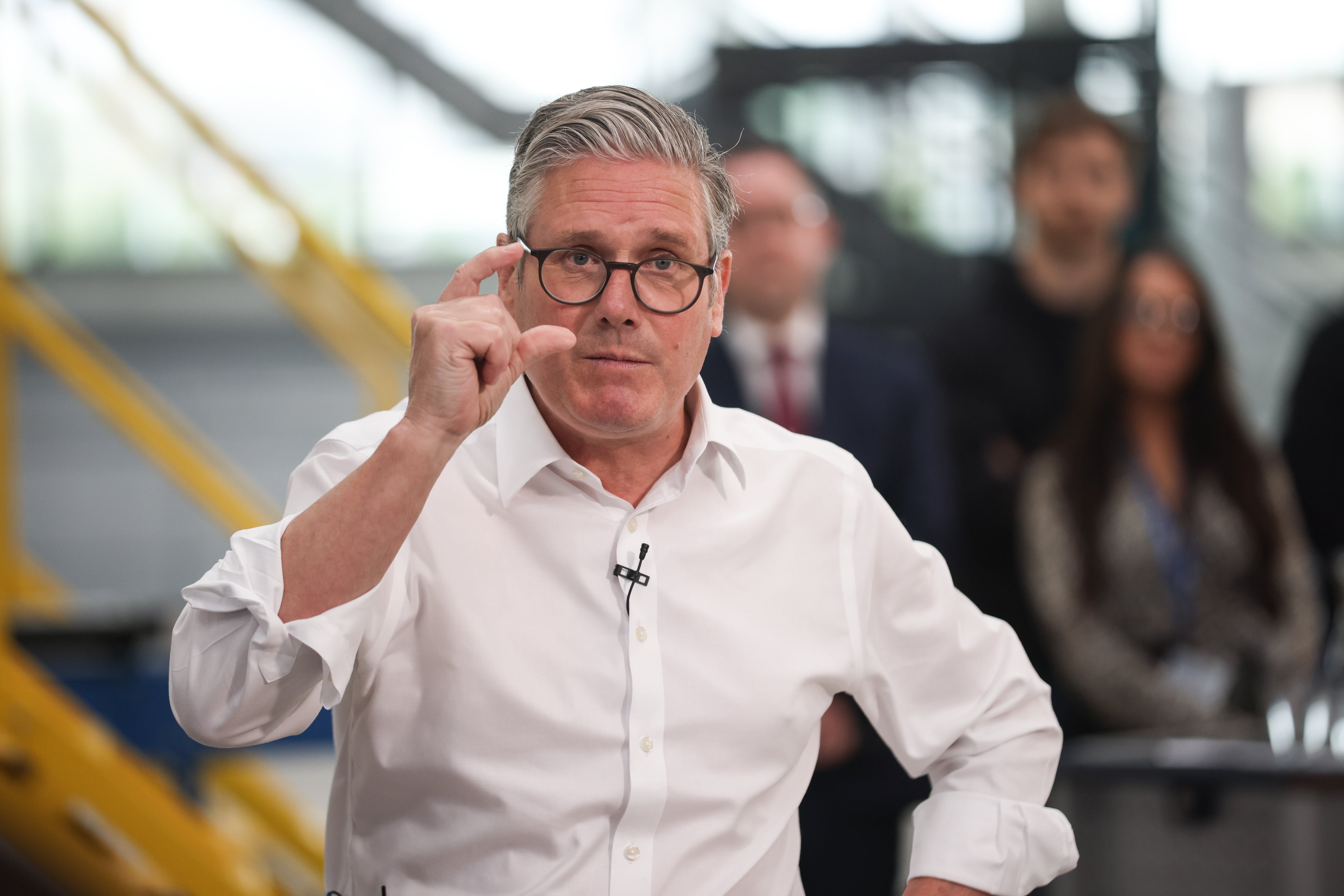 Prime Minister Sir Keir Starmer highlighted his working class background compared to Farage (James Speakman/PA)