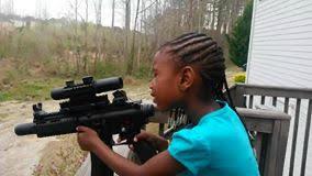 Naomi Thrasher, age 4, holding a Heckler and Koch 22LR (Long Rifle cartridge). The 22LR is the smallest caliber, and this is what Fred and his foundation start young children off with