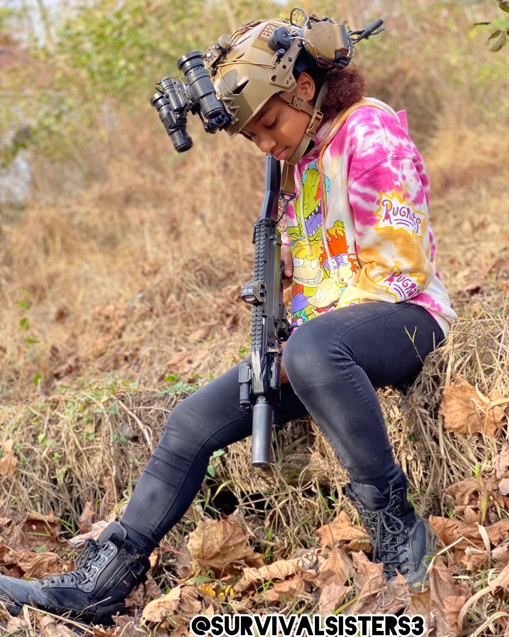 Kennedy, age 13, in tactical gear and a Rugrats sweater
