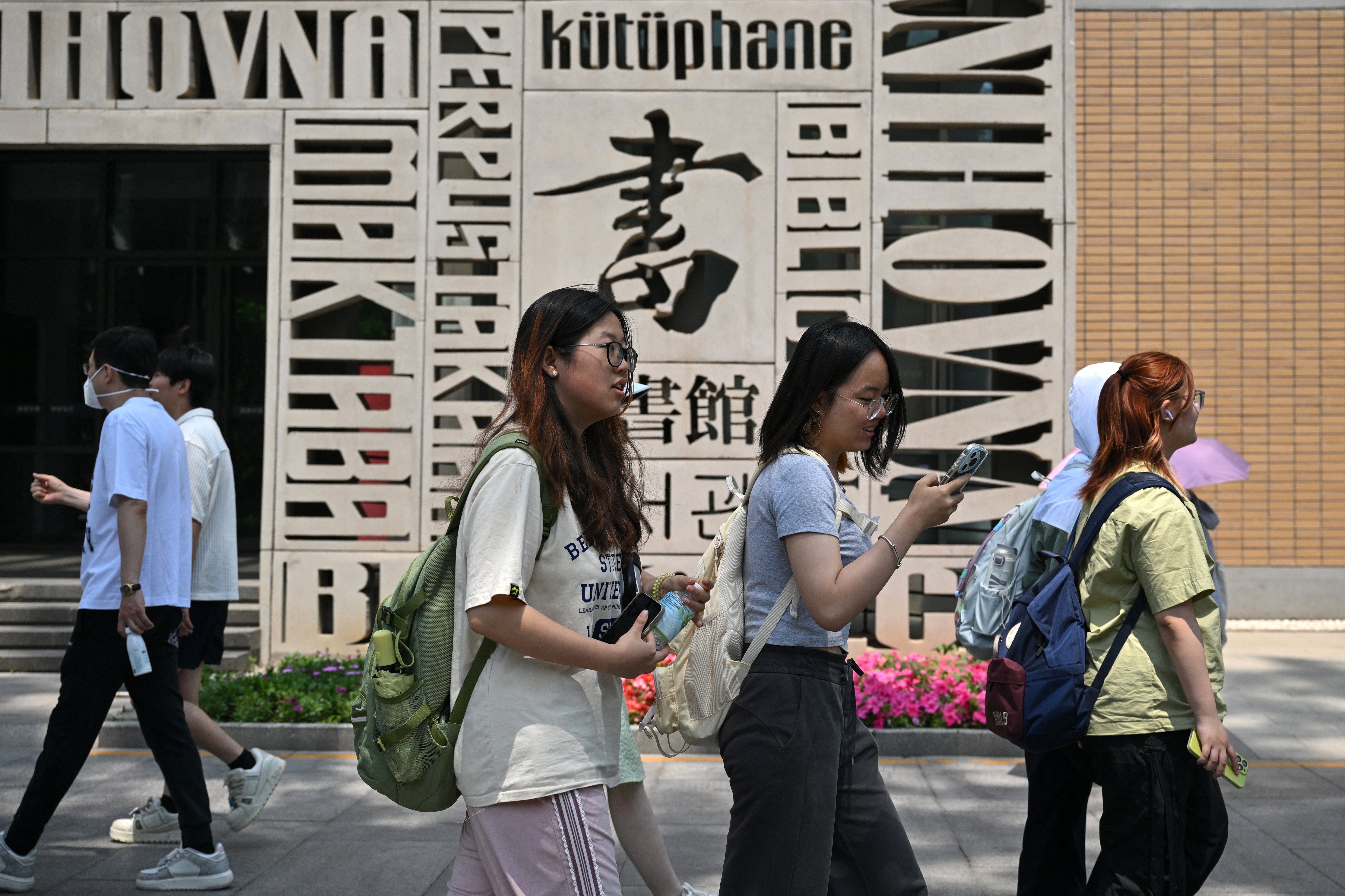 Students pictured at Beijing Foreign Studies University on Thursday in Beijing, where officials condemned Trump's threats to Chinese students studying in the United States as ‘political and discriminatory’