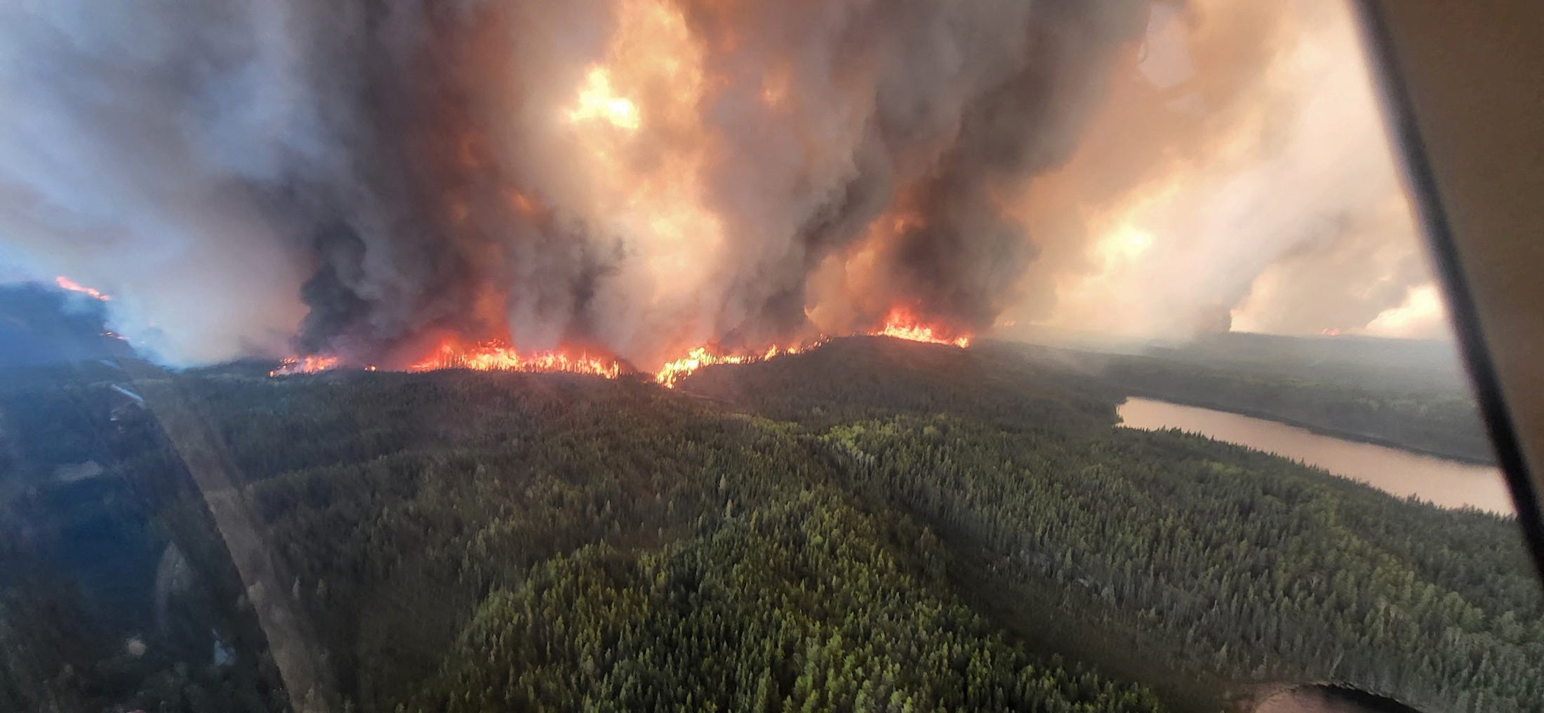 Smoke rises from a wildfire in Flin Flon, Manitoba, Canada
