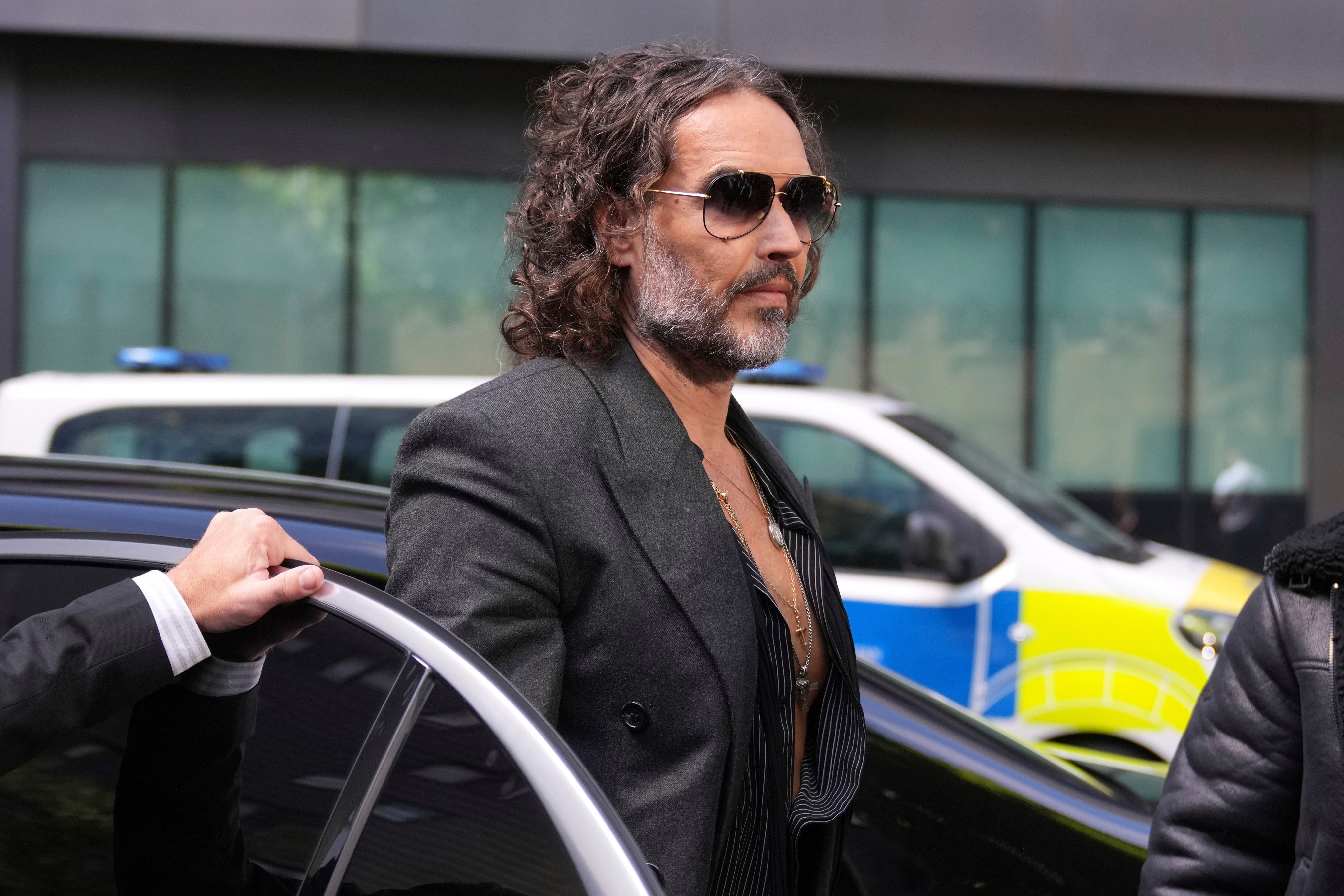 English comedian and actor Russell Brand arrives at Southwark Crown Court where he is charged with rape and sexual assault in London, Friday, May 30, 2025.(AP Photo/Alastair Grant)