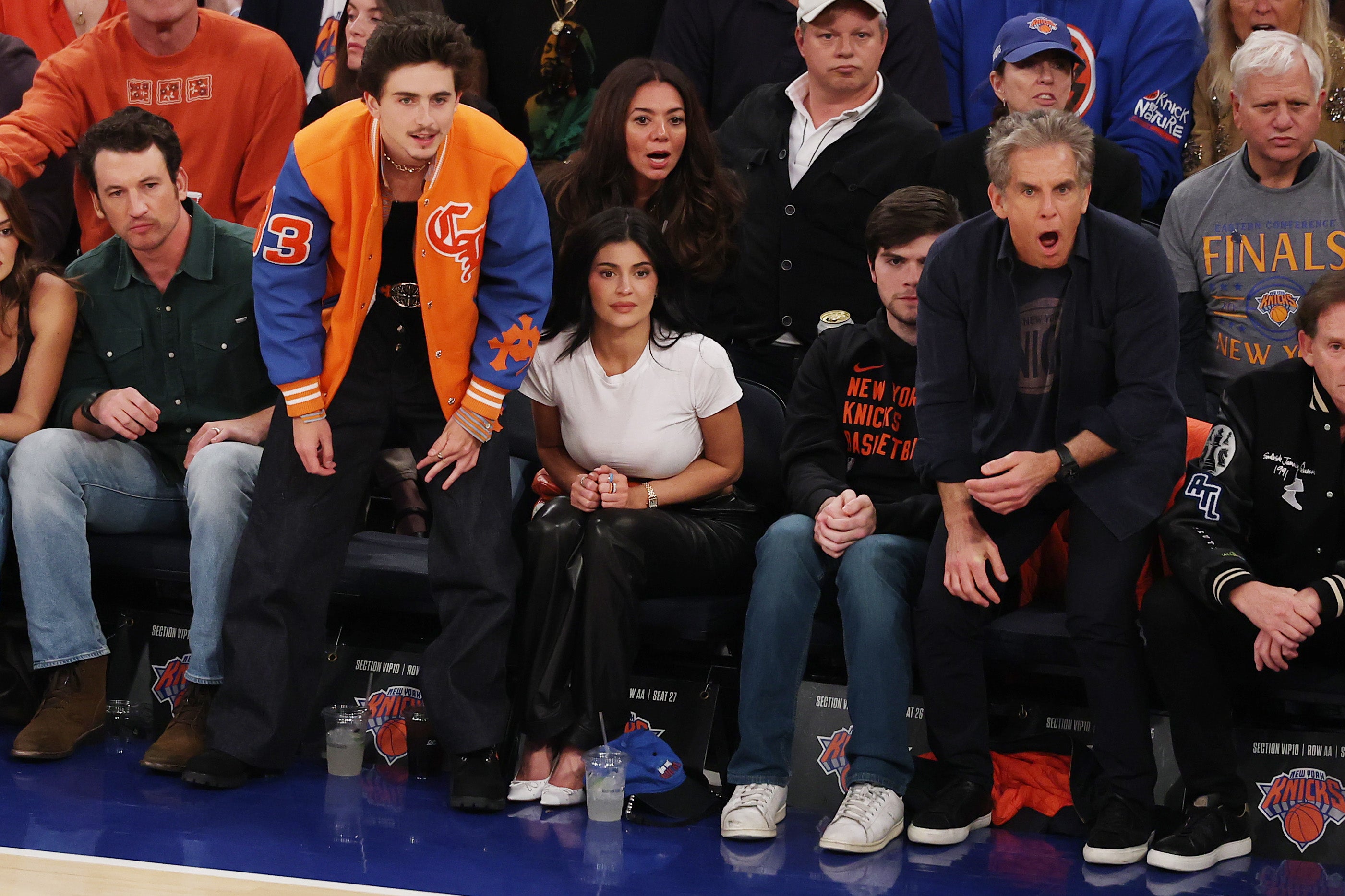 Chalamet and Jenner were spotted at Thursday's game alongside Miles Teller (left) and Ben Stiller (right)