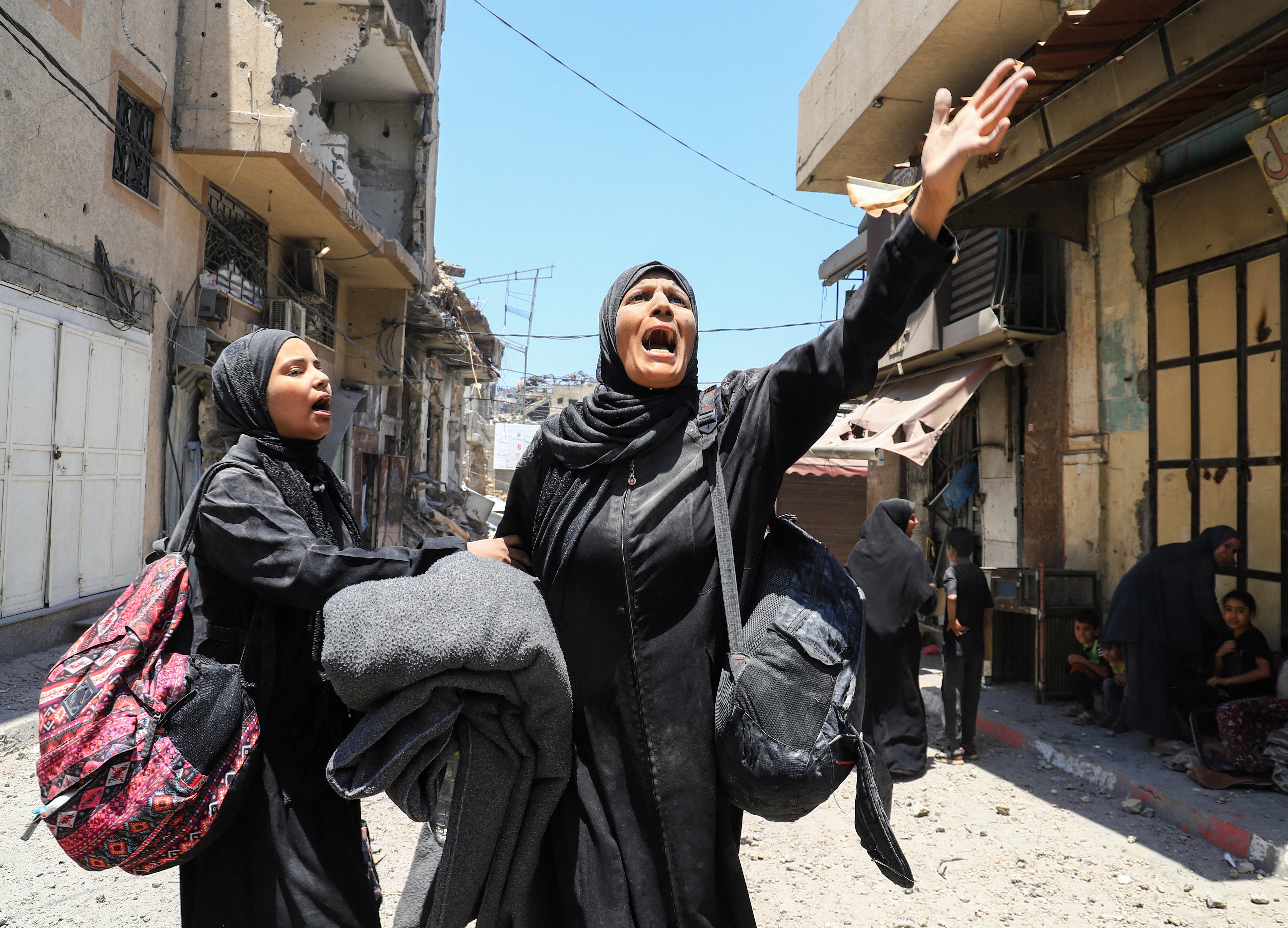 A Palestinian woman in the aftermath of an Israeli strike on a house in Gaza City on Friday