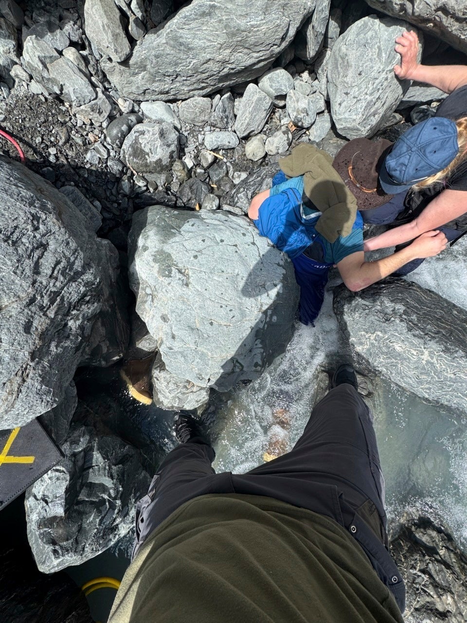 Kell Morris was hiking near Godwin Glacier in Alaska when a 700-pound boulder pinned him face down in an icy creek for three hours