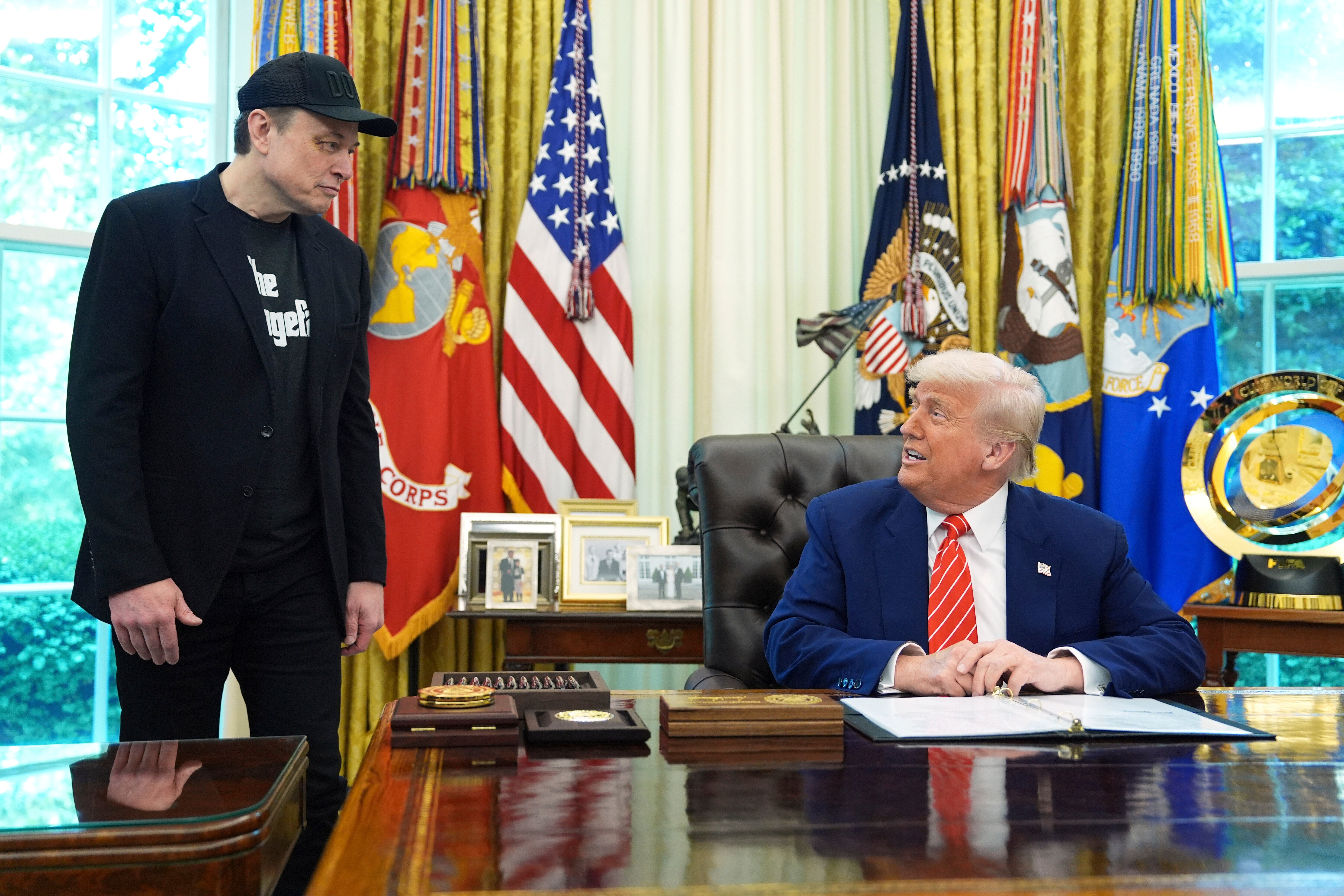 Trump praises Musk’s DOGE work as tech mogul shows up to Oval Office with black eye: Live
