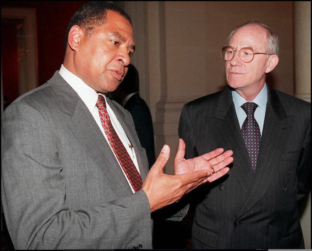 George Moose (left), then the U.S. Assistant Secretary of State for African Affairs, seen here in 1997 with French Foreign Minister Herve de Charette, was unceremoniously booted by DOGE as president of the United States Institute of Peace