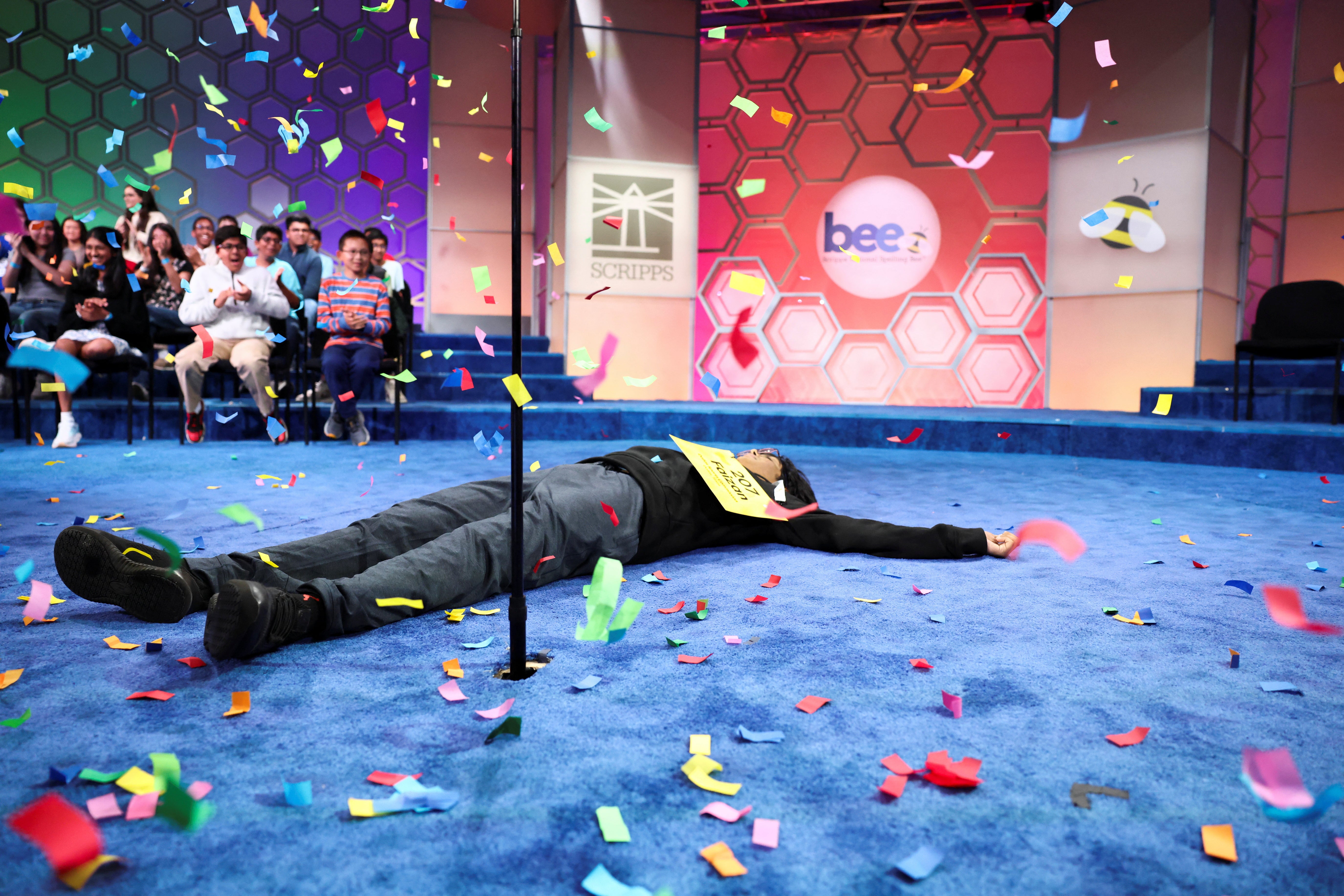 Zaki dropped to the floor after spelling his winning word right