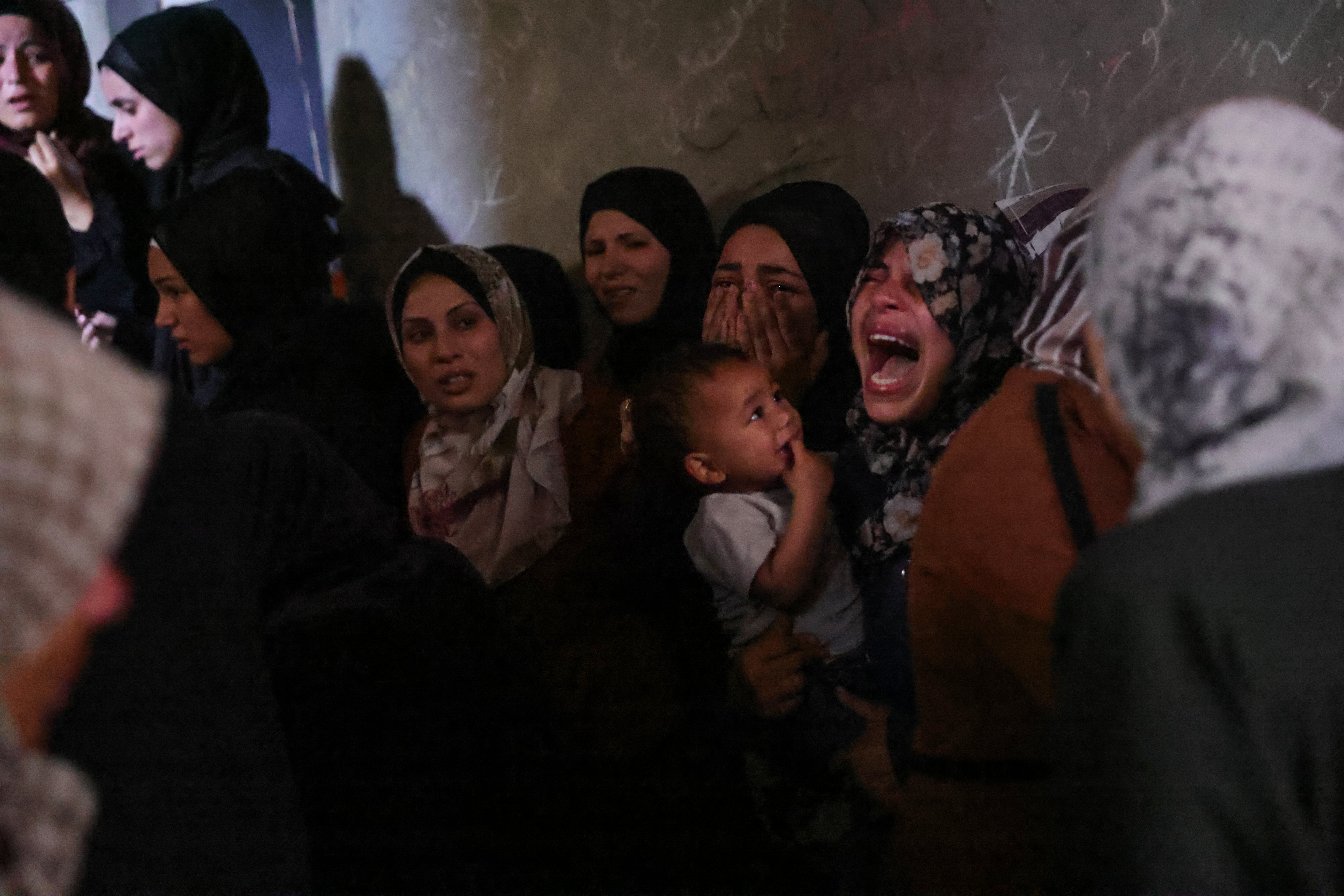 Palestinians mourn members of the Azzam family killed in Israeli strikes on their home in central Jabalia, Gaza, on 29 May 2025