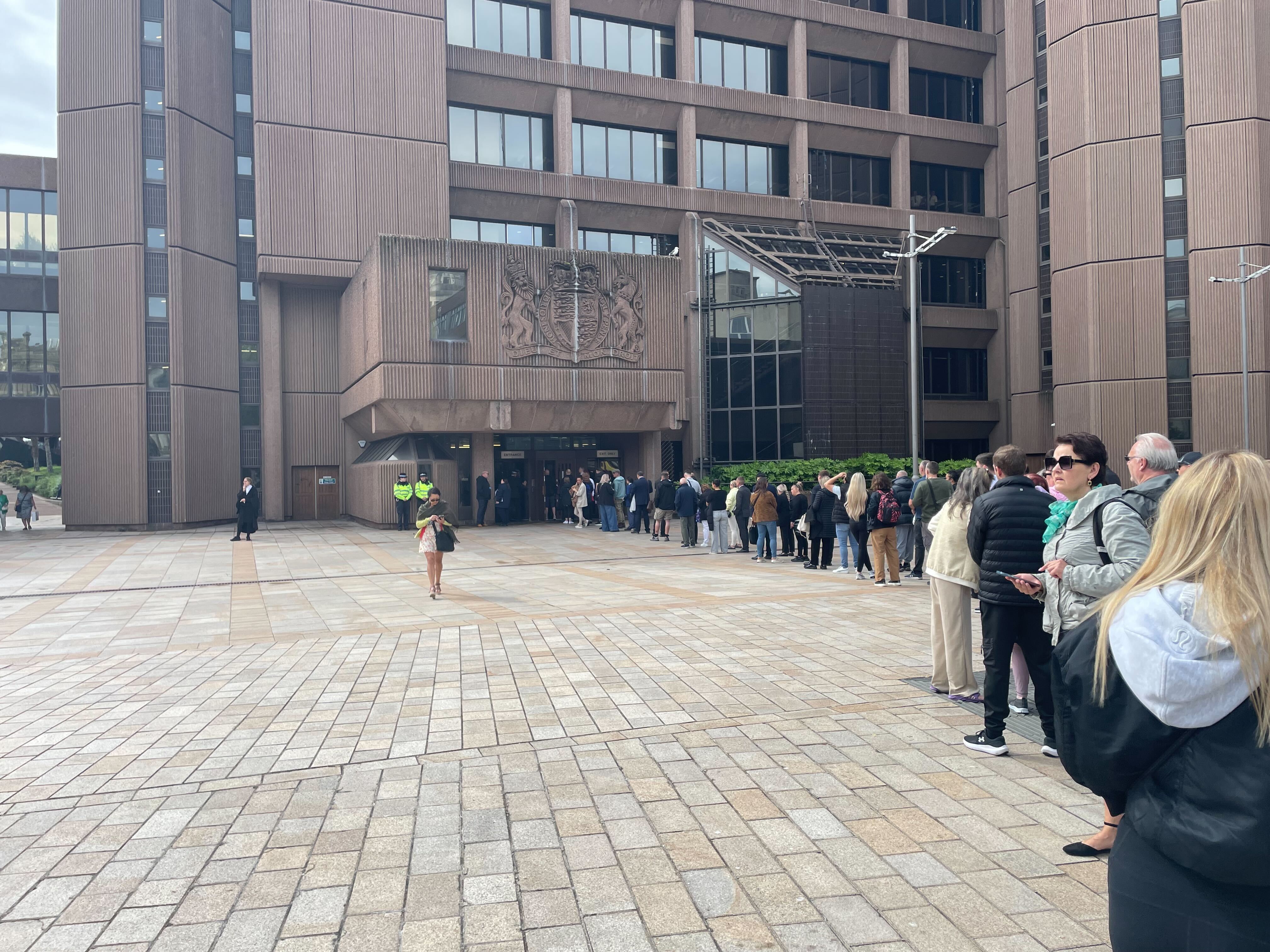 Dozens of people queued outside Liverpool Magistrates' Court