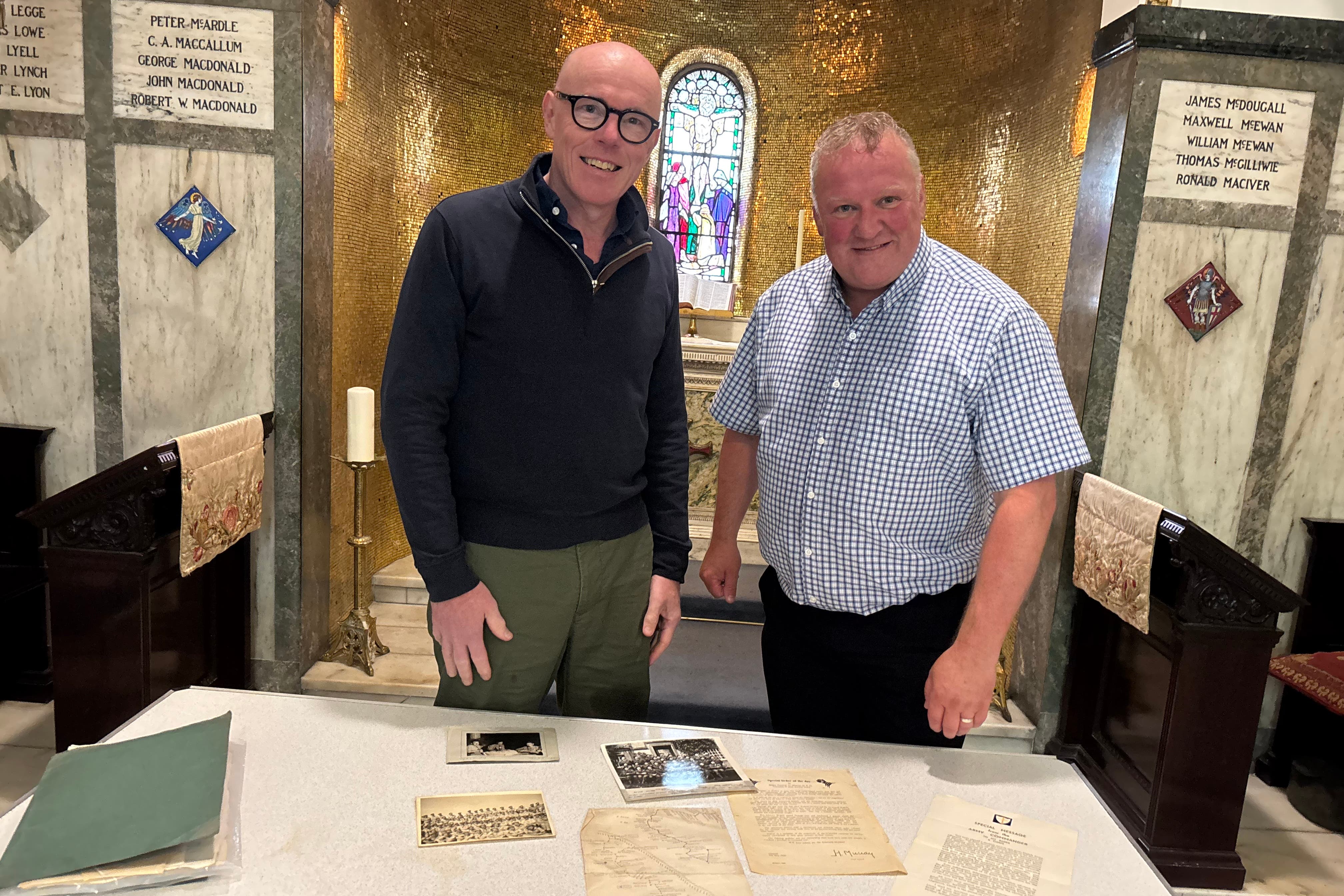 Sandy Rodger, left, met with Martin Reid to receive the papers (Church of Scotland/PA)