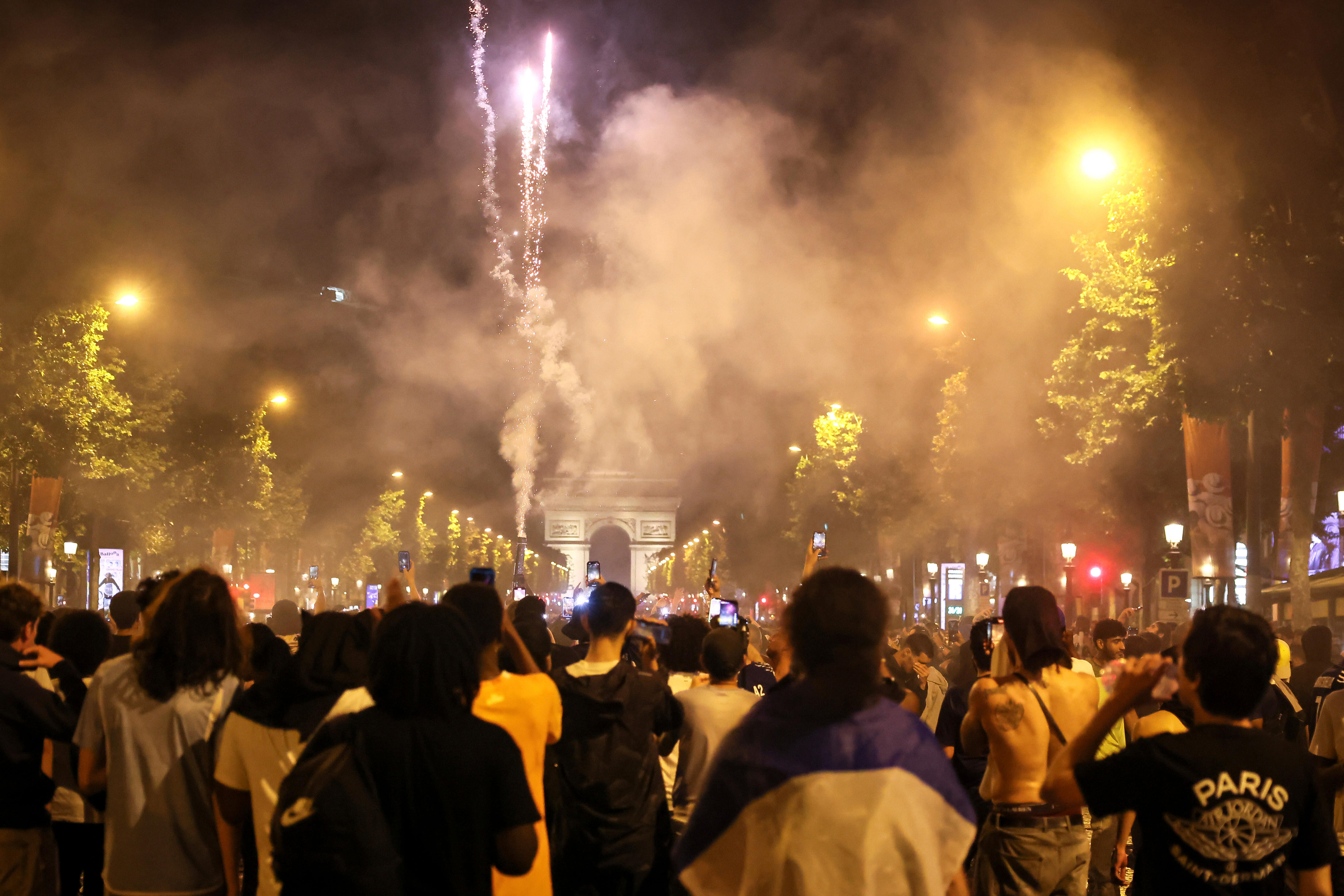 PSG supporters invade the Champs-Elysees avenue (Thomas Padilla/AP)