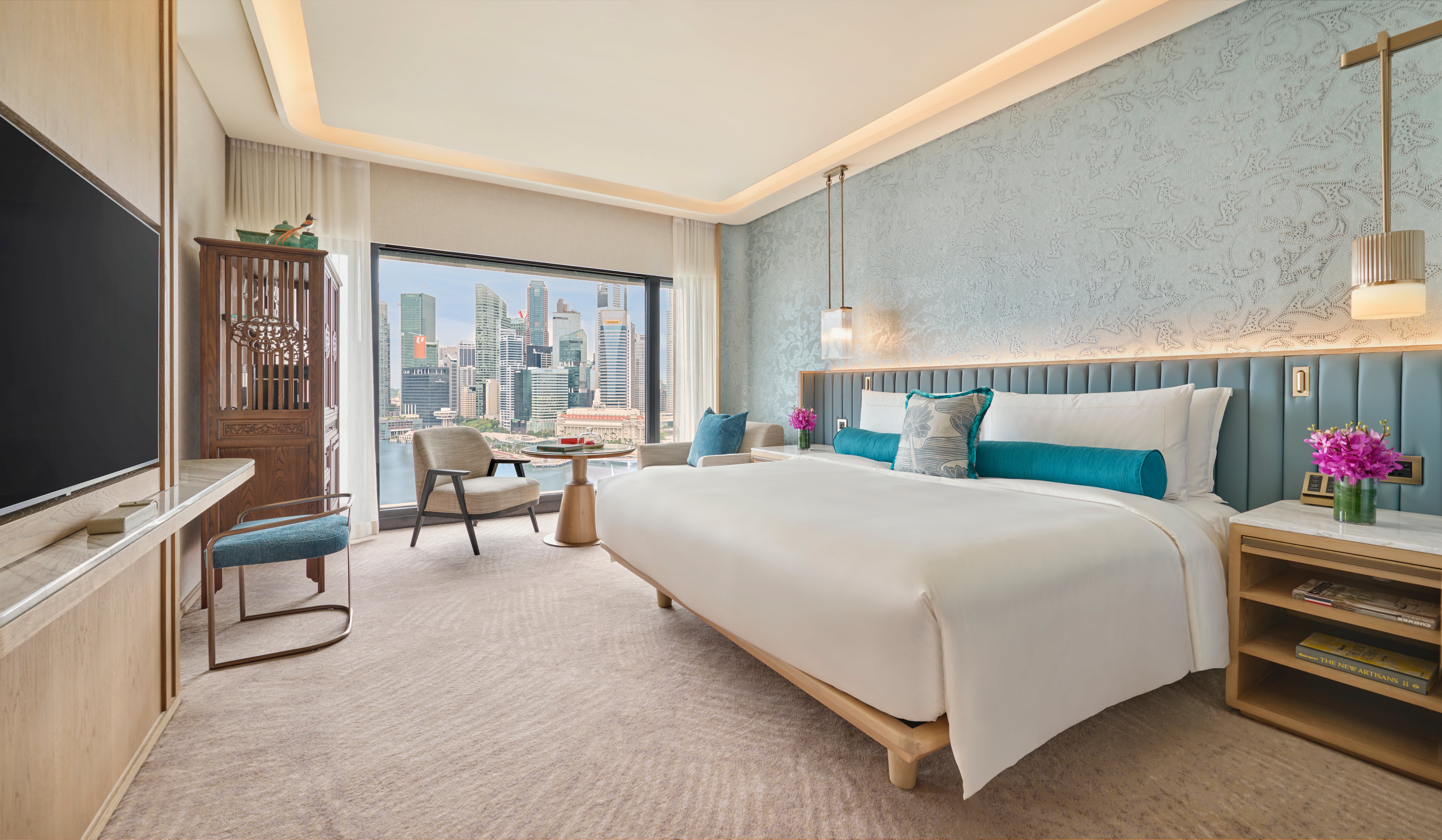 A Marina Bay View room. The decor is neutral with splashes of colour